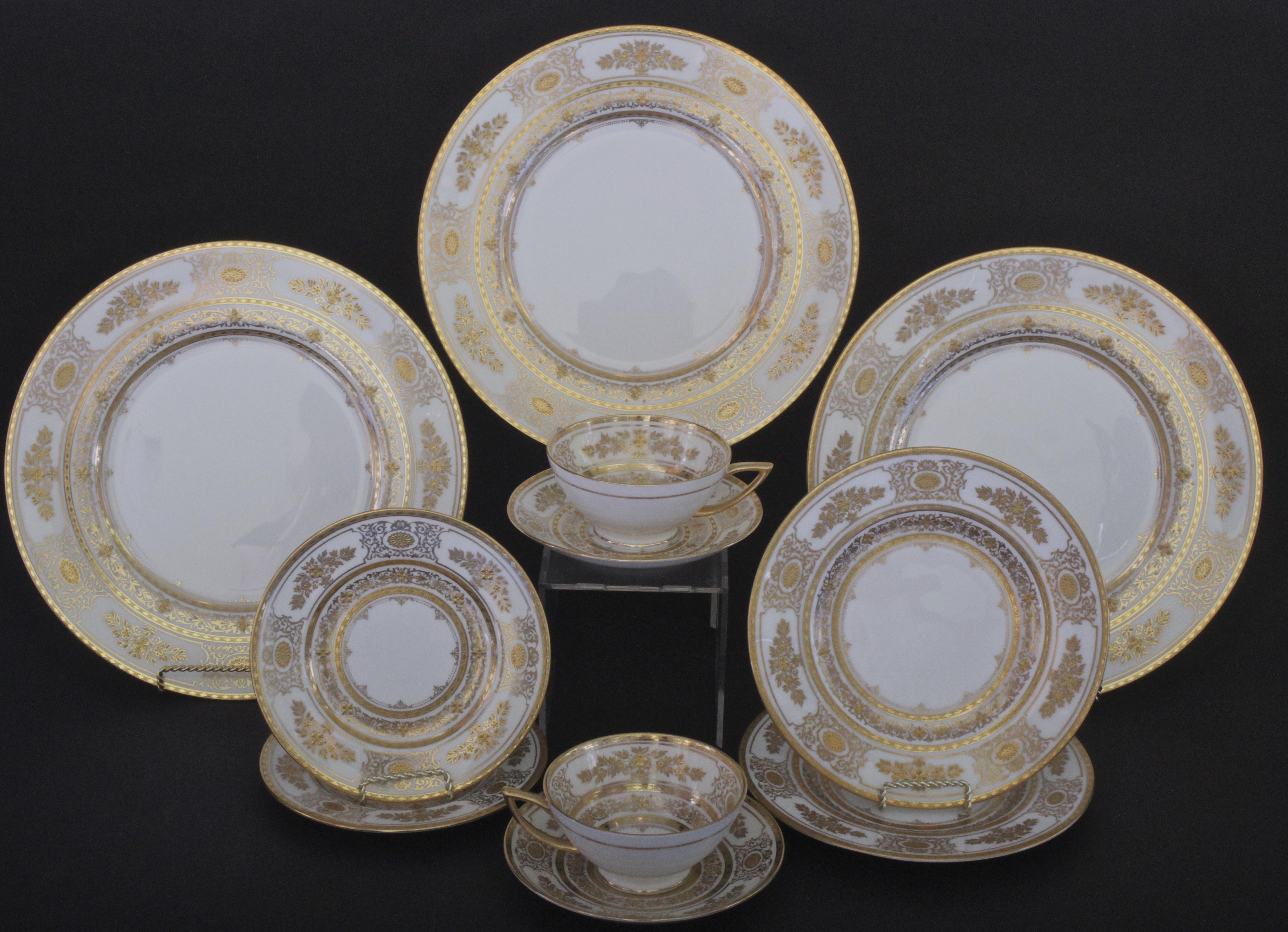 Here is a rare gilded service for 12 from Minton, Stoke-on Trent, England. This ornate and beautiful pattern is called Argyle. The set includes dinner, salad/dessert and bread plates, as well as teacups with saucers. One extra dinner plate is