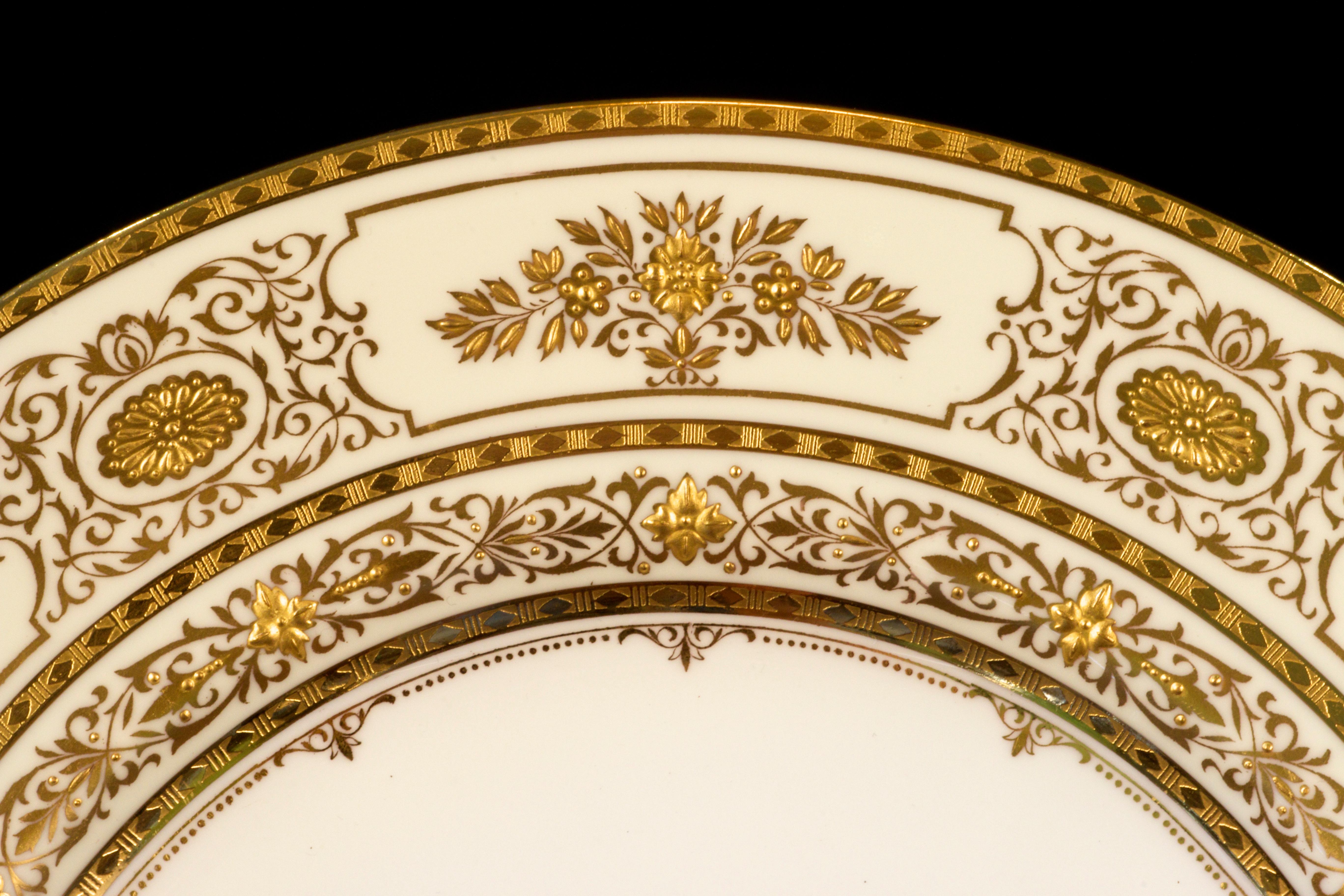 Service for 12 of Minton for Tiffany Ivory Gilded Plates In Excellent Condition For Sale In New York, NY