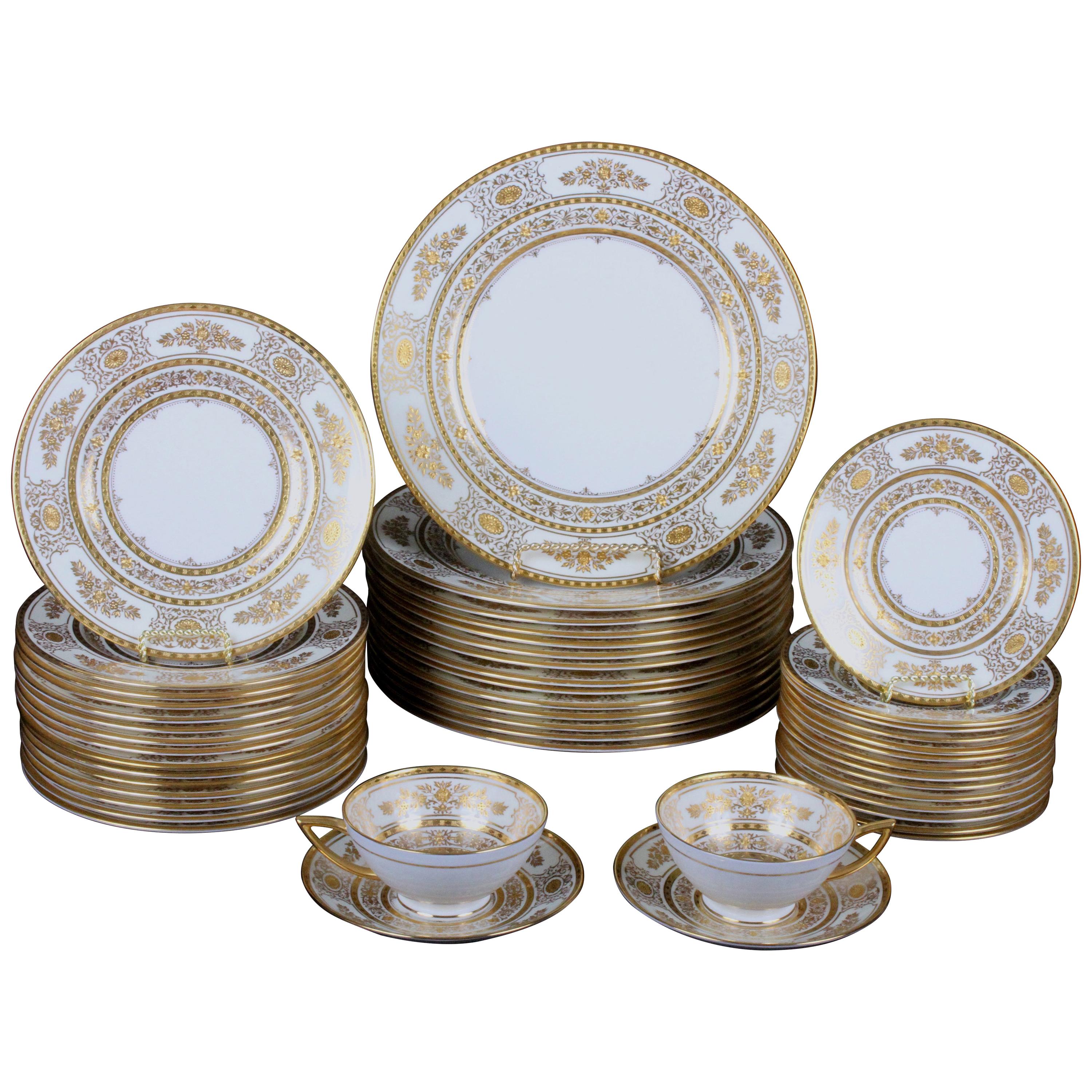 Service for 12 of Minton for Tiffany Ivory Gilded Plates For Sale
