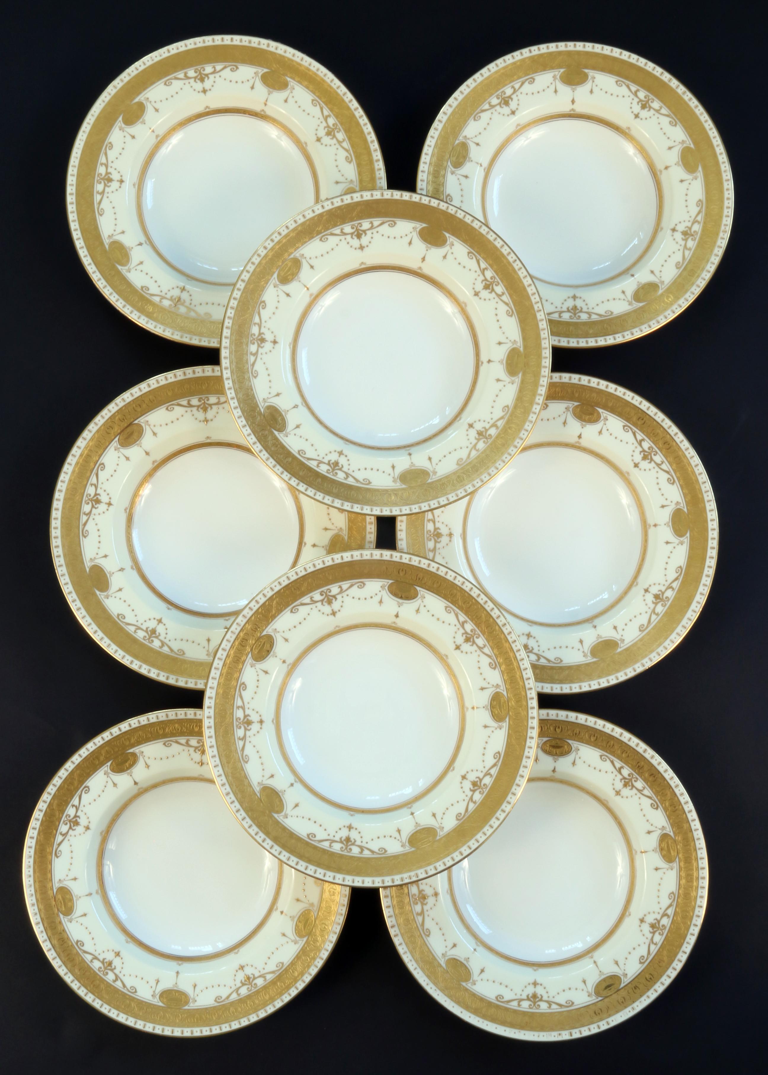 Here is a rare and gorgeous 22-karat gold on ivory-ground complete service for 8 from Minton, stoke-on Trent, England. The set includes dinner, soup and salad/dessert plates. Extra pieces include 3 dinner plates and 1 salad plate for 28 pieces