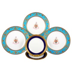 Service of Minton Turquoise and Gold Encrusted Armorial Plates with Side Plates
