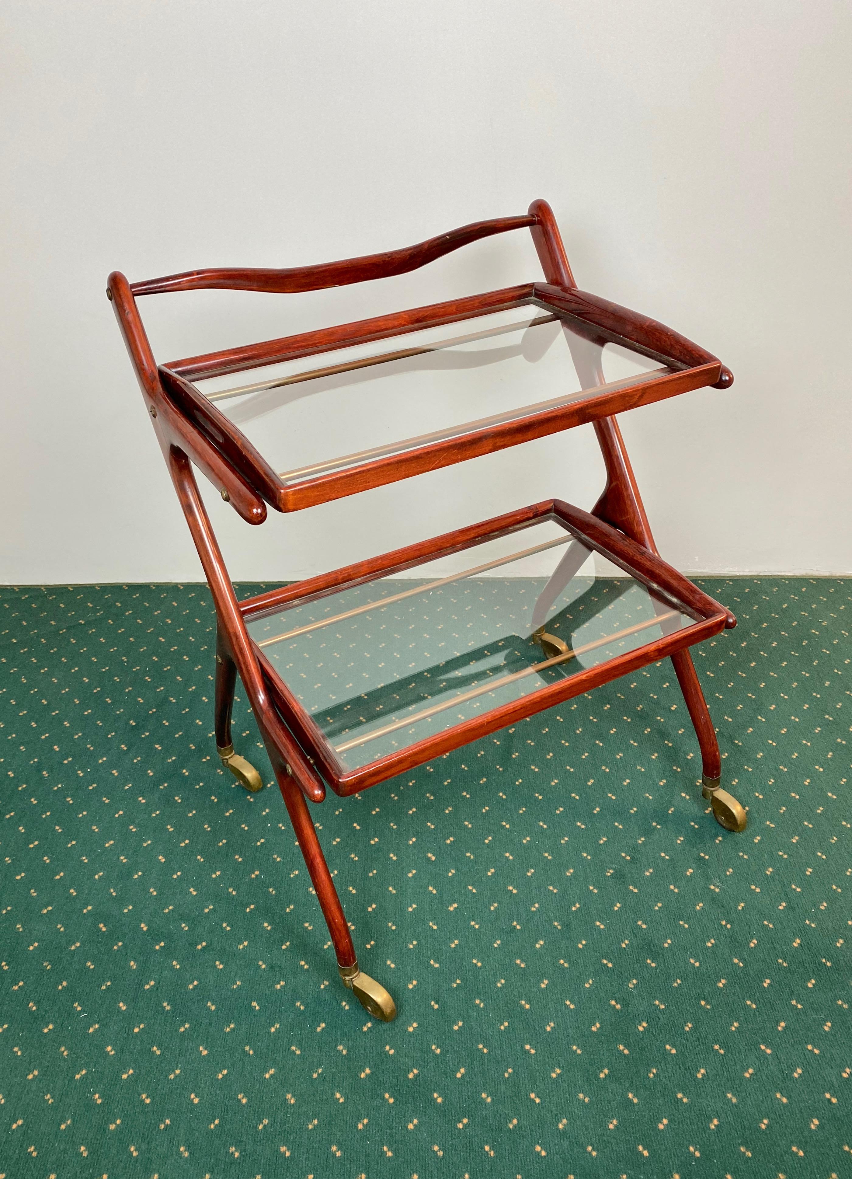 Serving bar cart in wood and brass details composed of two removable glass trays by the Italian designer Cesare Lacca, 1950s.