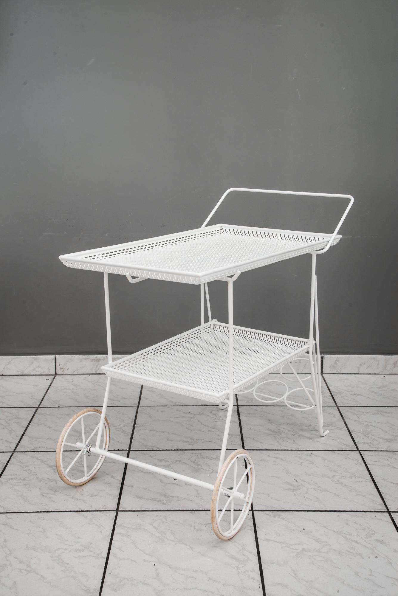 Serving cart with 3 bottle holders vienna around 1950s
The top can be removed for serving 
Iron white lacquered.