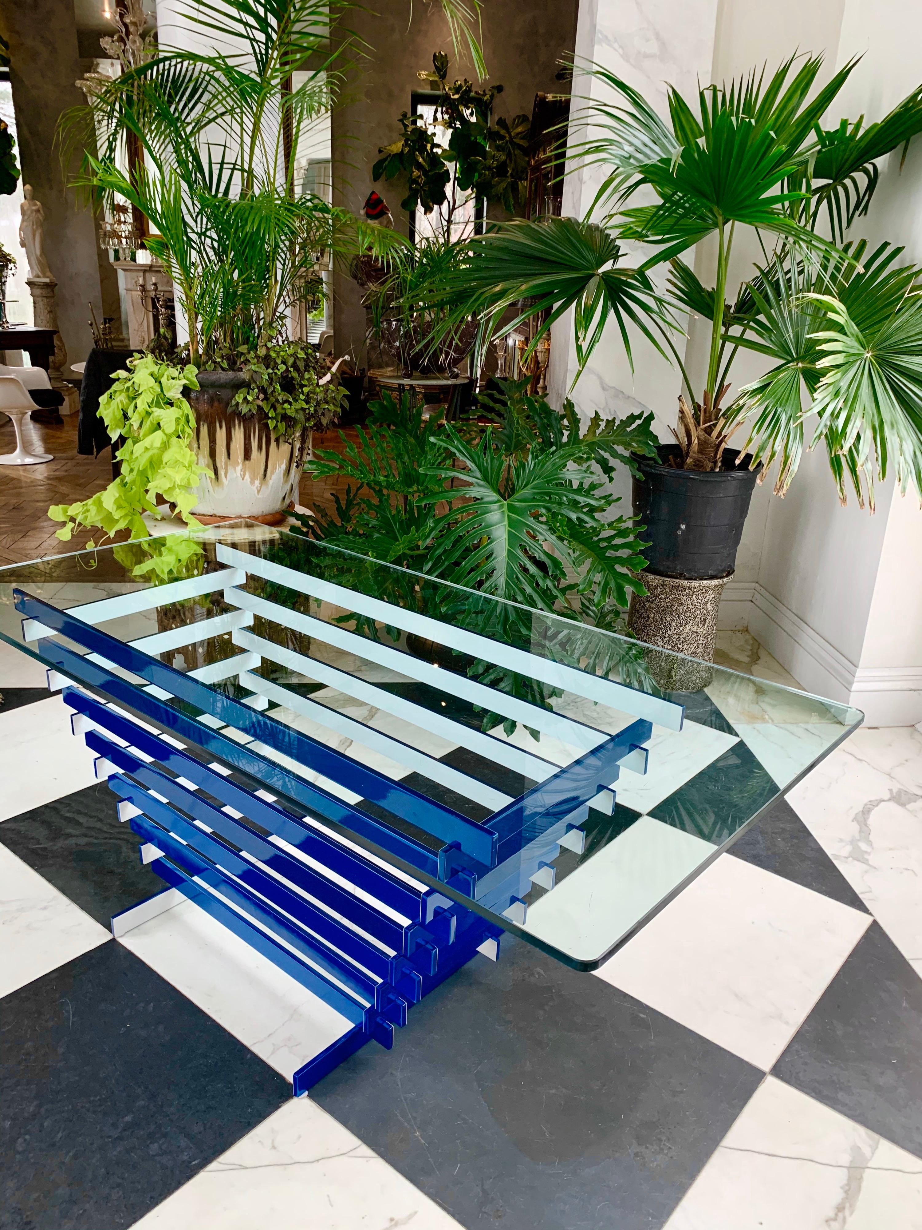 This steel base serving table could also be used as a bar or dining table. It is attributed to Paul Mayen.
It is professionally painted in metallic blue and white.
