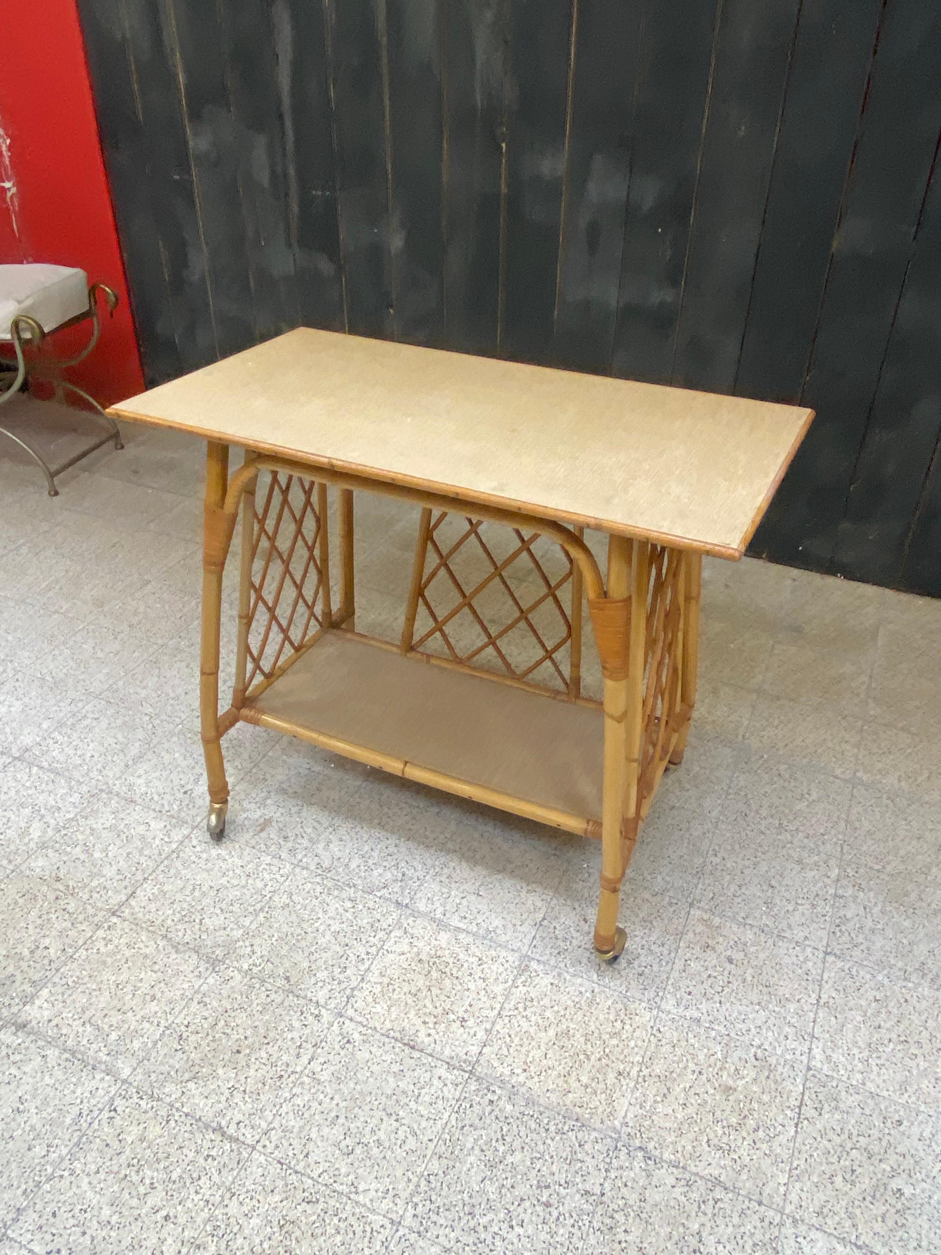 Serving table that can serve as a multimedia table (tv, hi-fi) in bamboo, circa 1960.