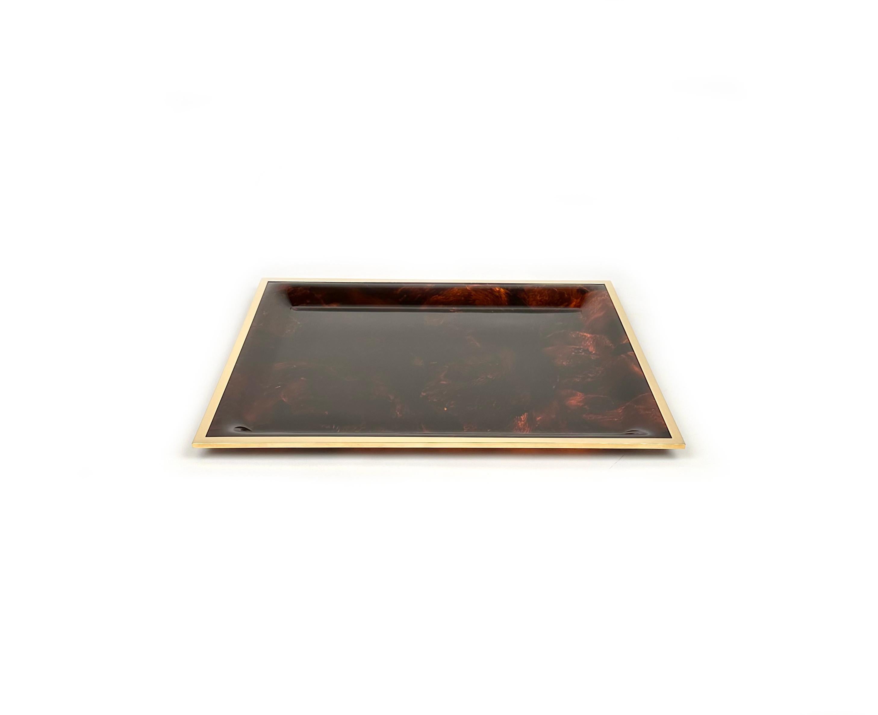 Amazing large rectangular serving tray or vide-poche in tortoiseshell effect Lucite and brass borders in the style of Christian Dior. 

Made in Italy in the 1970s. 

Great accessory for any modern interior.