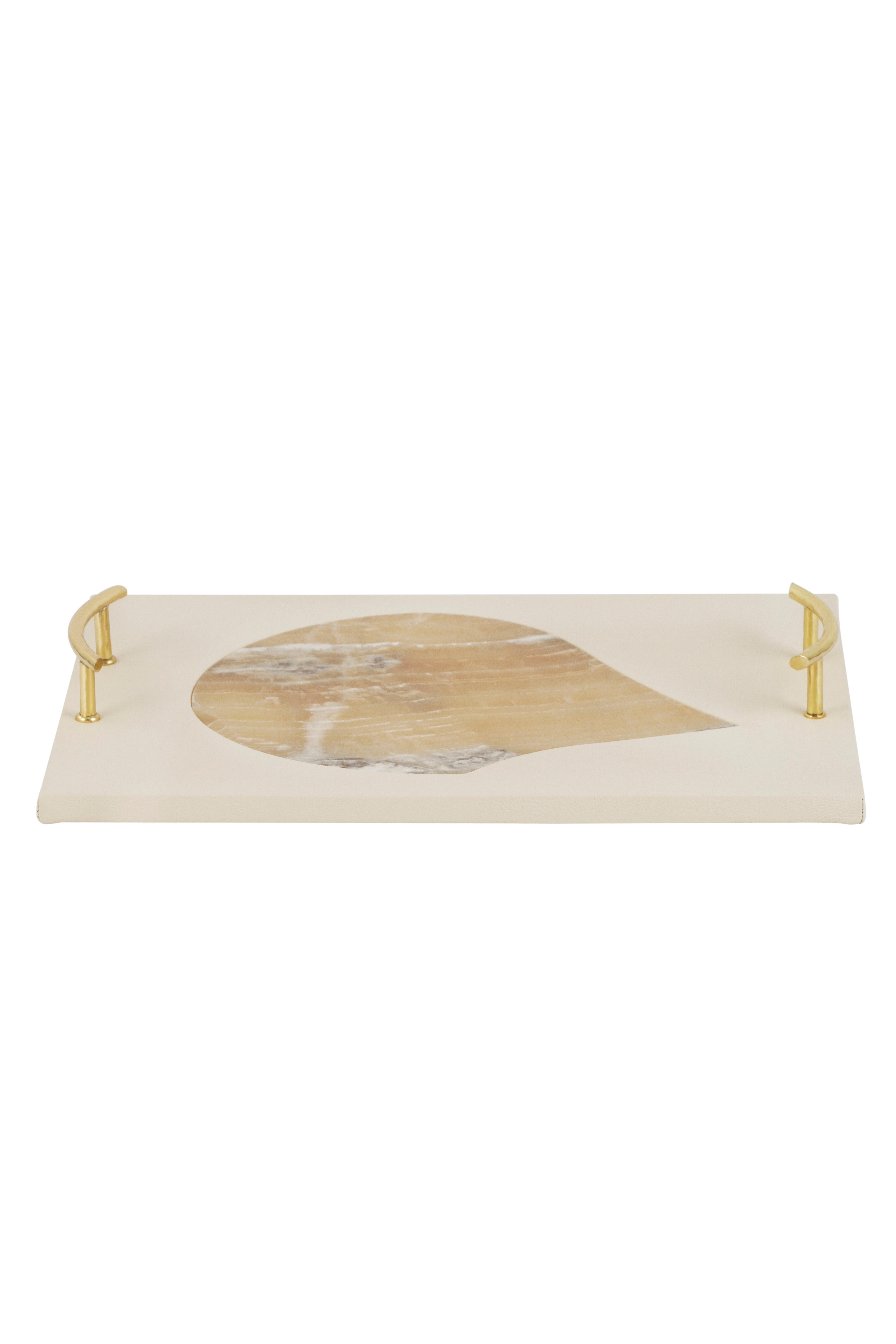 Serving Tray, Lusitanus Home Collection, Handcrafted in Portugal - Europe by Lusitanus Home.

A sublime serving tray, Oshu was design to uplift layback moments. A serving tray upholstered in cream leather with inlaid Shadow onyx and polished brass