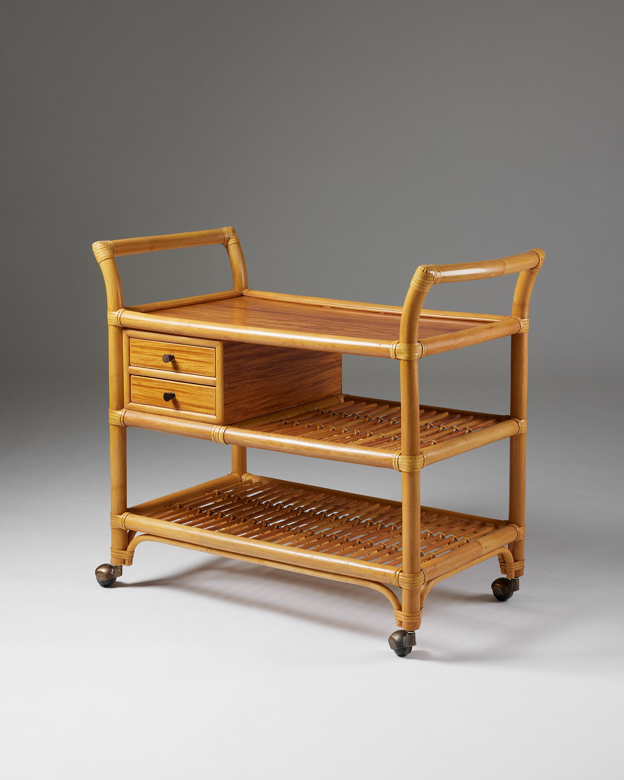 Serving trolley, anonymous, for DUX,
Sweden, 1960s.

Rattan and bamboo.

H: 78 cm
W: 48 cm 
L: 91 cm
