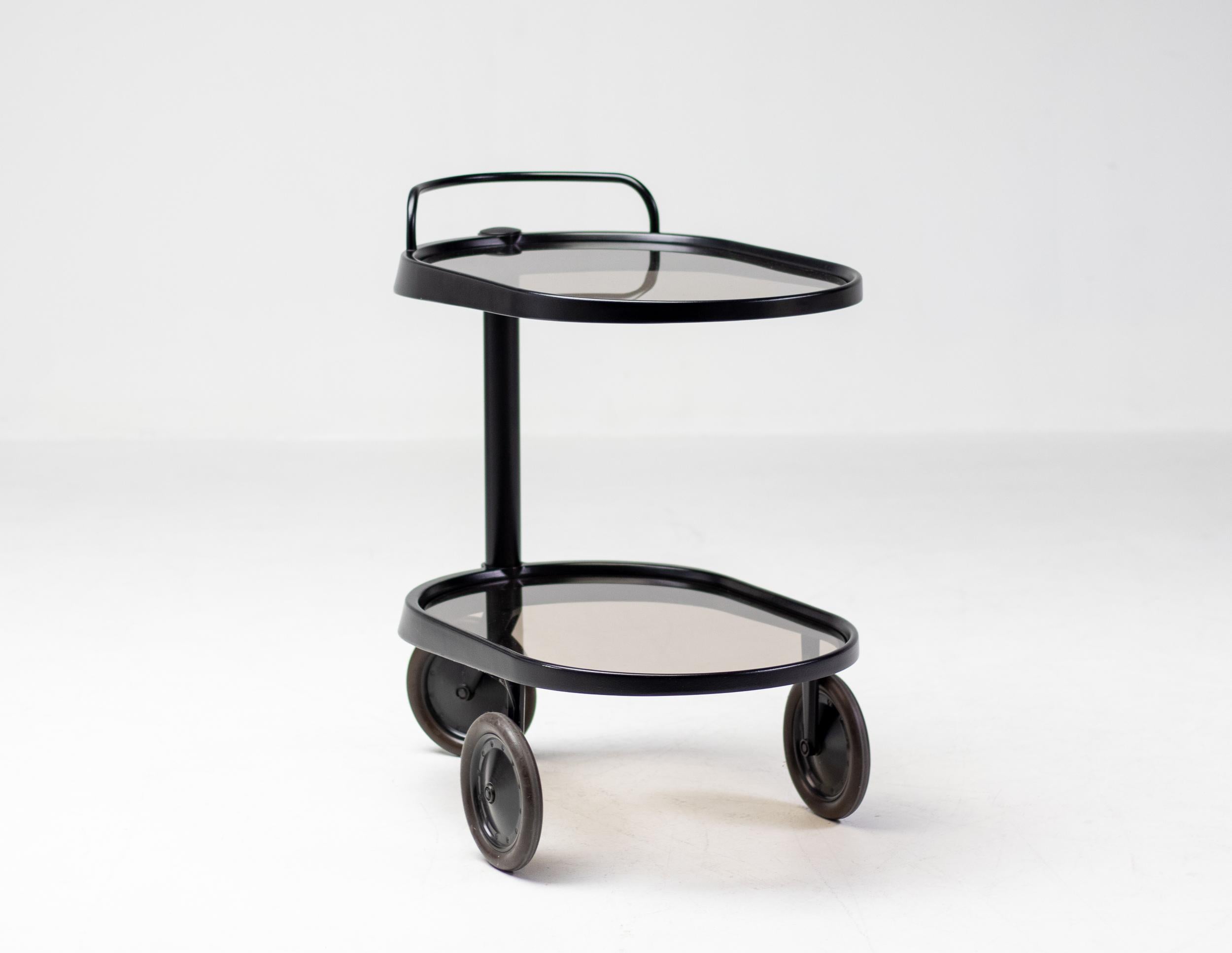 Modern trolley designed by Enzo Mari for Alessi in 1989.
Handlebar above a cylindrical shaft side support, on three wheels, stamped Alessi.
Very hard to find and in this color.

Enzo Mari was an Italian modernist artist and furniture designer