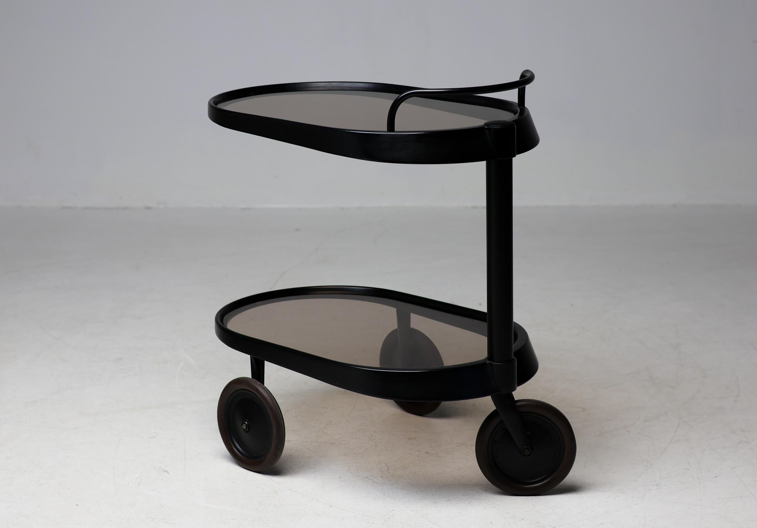 Modern trolley designed by Enzo Mari for Alessi in 1989.
Handlebar above a cylindrical shaft side support, on three wheels, stamped Alessi.
Very hard to find, especially in this color.
Complete with the original Alessi leaflet.

Enzo Mari was an
