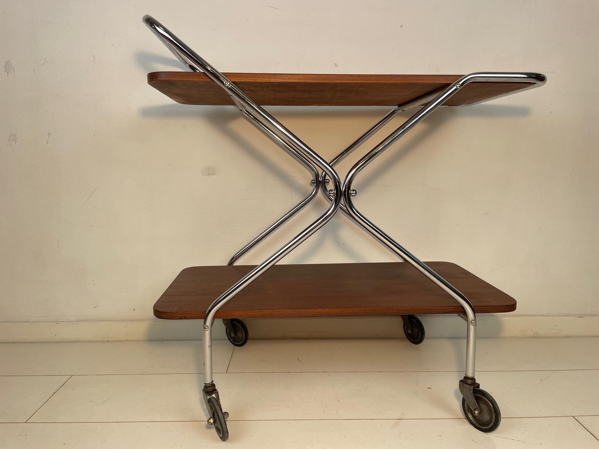 Beautiful trolley! Absolute stunner for every home, bar or restaurant. 
Looking great in every interior. Chrome in perfect condition, wood has beautiful patina.