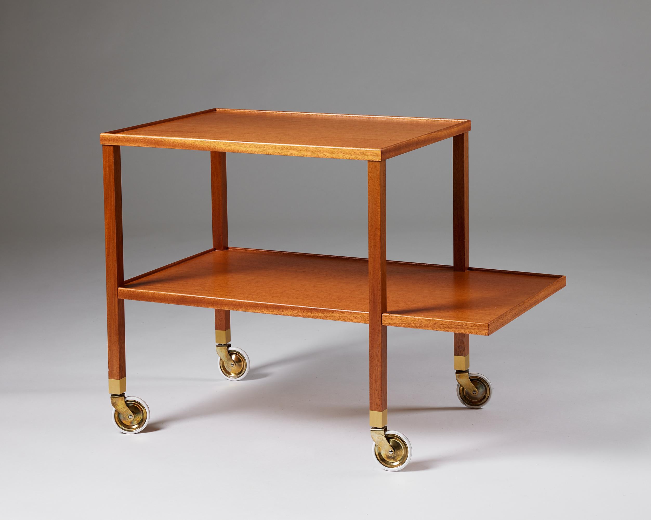 Serving trolley model 470 designed by Josef Frank for Svenskt Tenn,
Sweden, 1950s.

Mahogany.

Stamped.

H: 60 cm
W: 80 cm
D: 45 cm

Josef Frank was a true European, he was also a pioneer of what would become classic 20th century Swedish design and