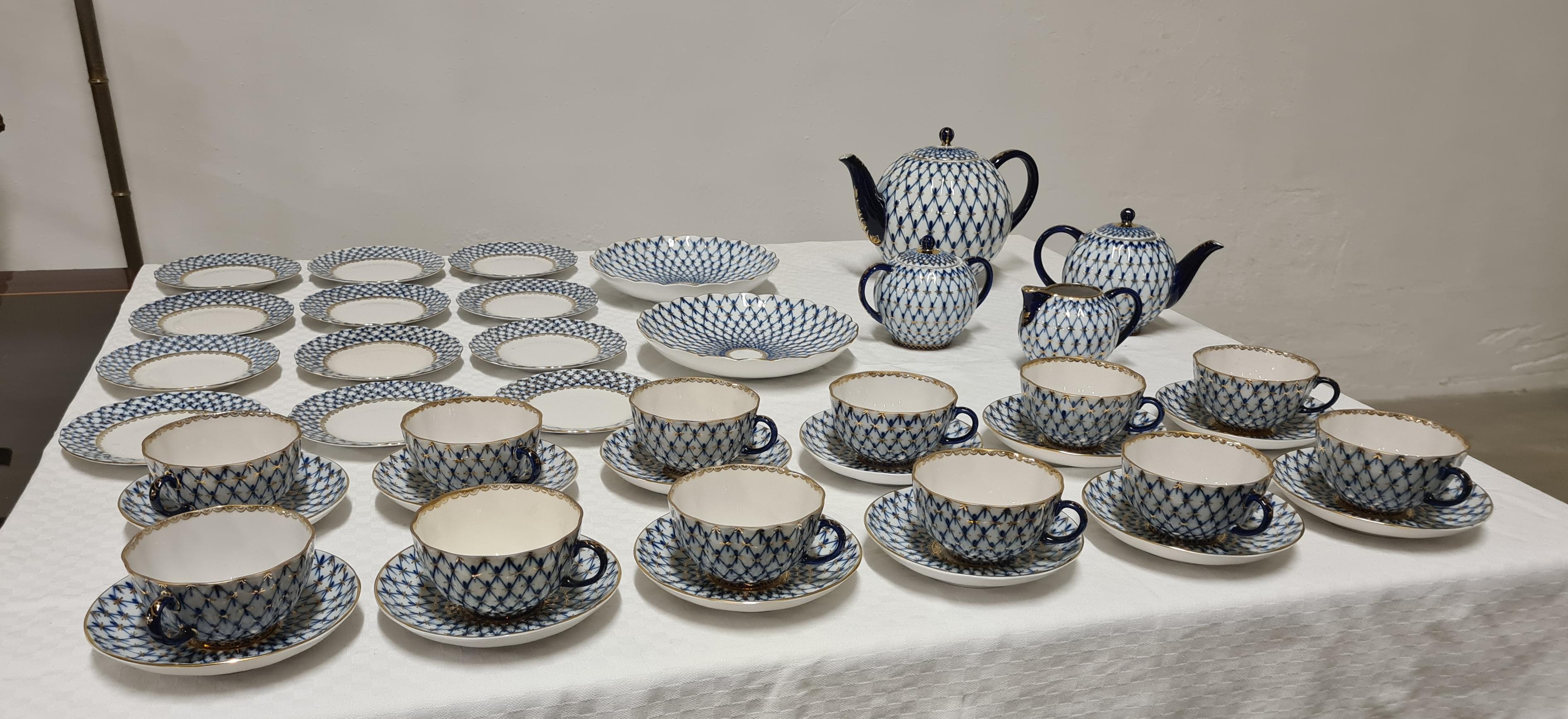 Cobalt Net model tea service from the Russian Imperial Lomonosov Factory.

Very fine tea and pastry service for 12 people.

Made of the finest hand-decorated porcelain with blue tones and the inclusion of pure gold details.

The Russian Imperial