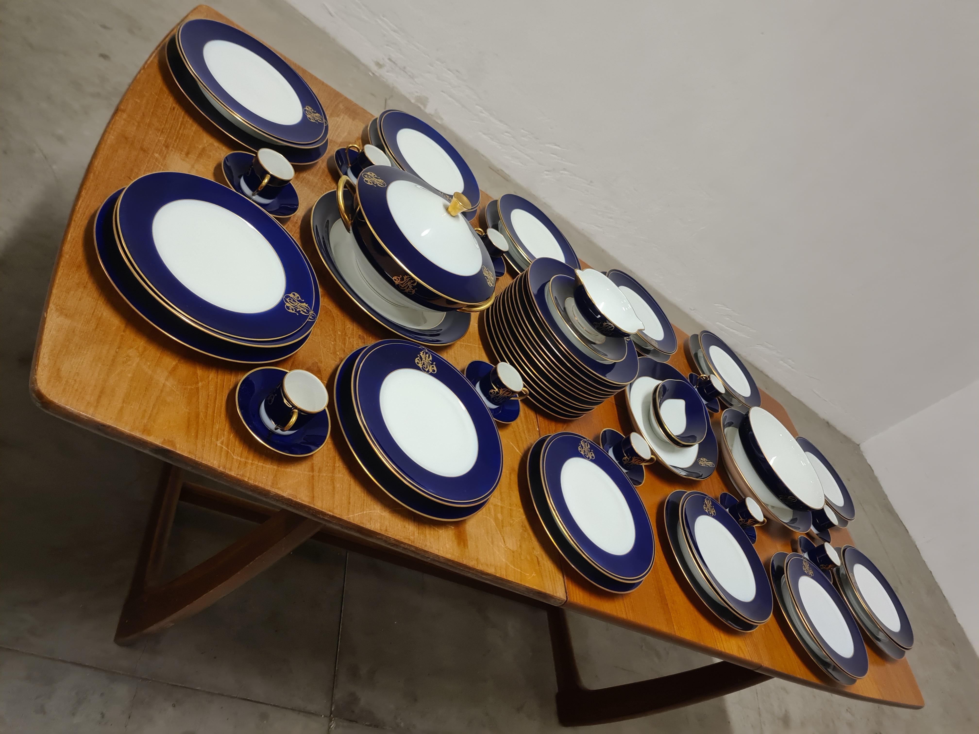 Service for 12 people, Cobalt blue by Rocal Limoges.

Fine French service, in fine white Limoges porcelain.

Decorated with thick cobalt blue enameled edging and 24-karat pure gold details.

Service made to order as there are initials on each