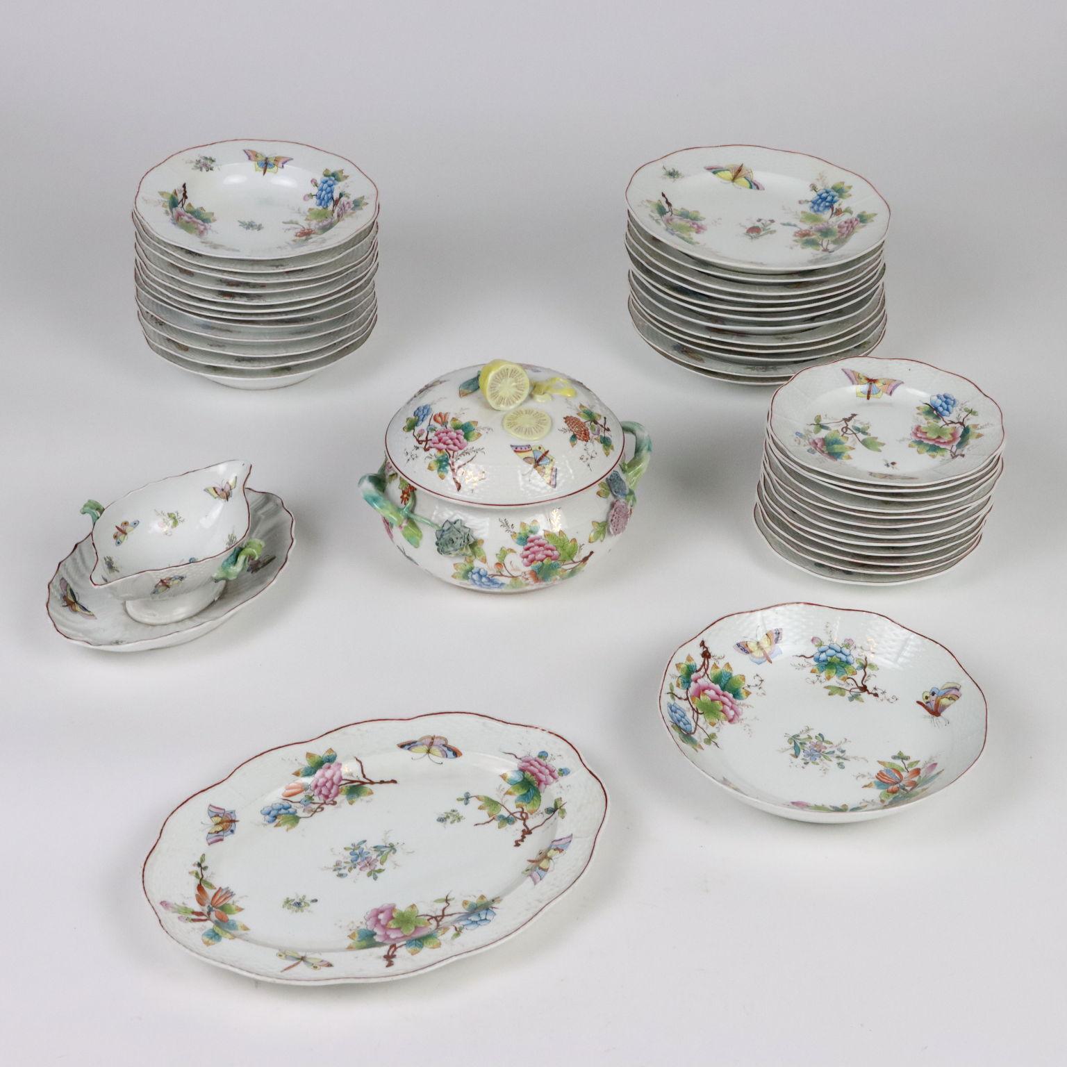 Herend Manufactory Queen Victoria Porcelain dinner service for 12 persons consisting of: 1 soup bowl, 1 gravy boat, 12 dinner plates, 12 soup plates, 12 dessert plates, 2 serving plates. Under engraved mark of manufacture. 