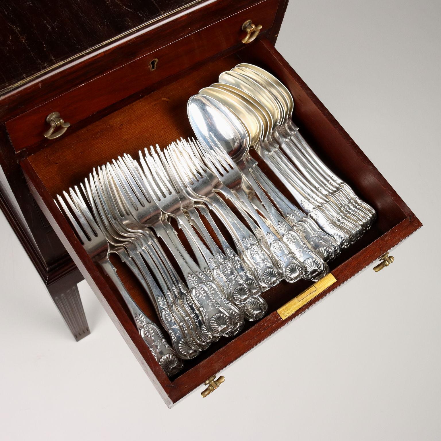 Silver flatware set consisting of 12 spoons, 12 forks, 12 fruit spoons, 12 fruit forks, 12 dessert spoons, 12 coffee spoons, 6 serving flatware Manufacture James & William Marshall Edinburgh 1850. 12 knives and 12 fruit knives Manufacture S&L