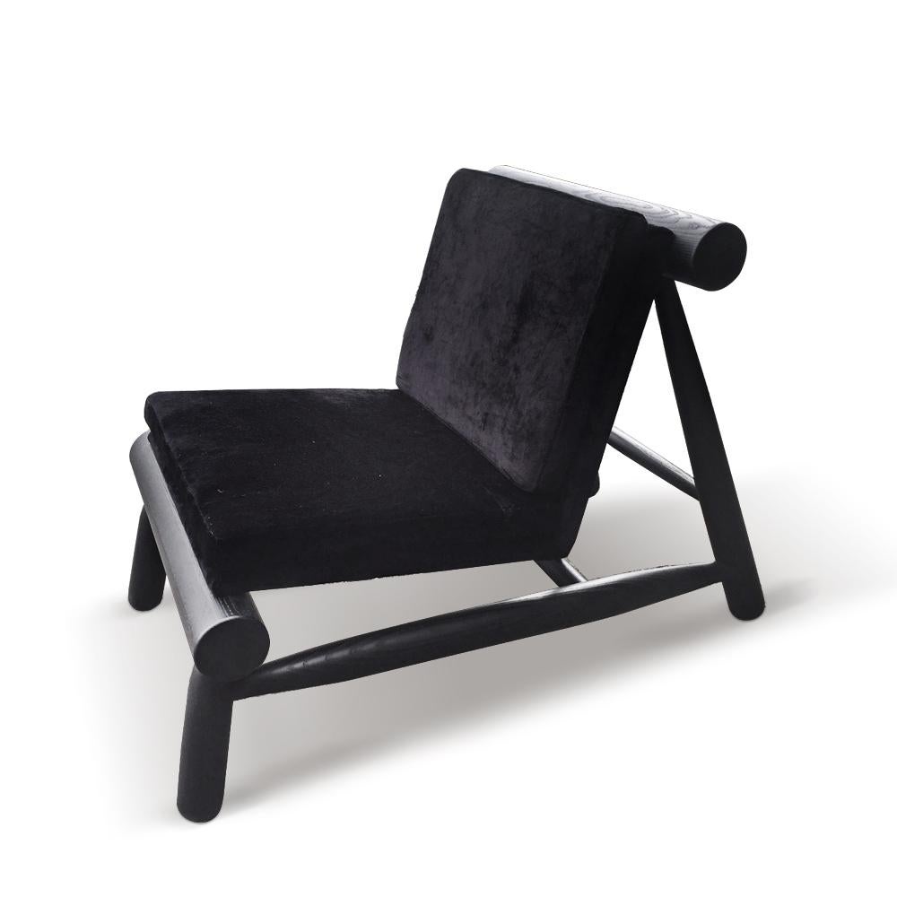 Seso armchair by Collector
Designer: Davide Monopoli
Materials: Upholstered in Siege Black Fabric. Solid oak wood structure.
Dimensions: W 61 x D 90 x H 70 cm x SH 43 cm

Seso series it’s all about tension. With a playful combination of