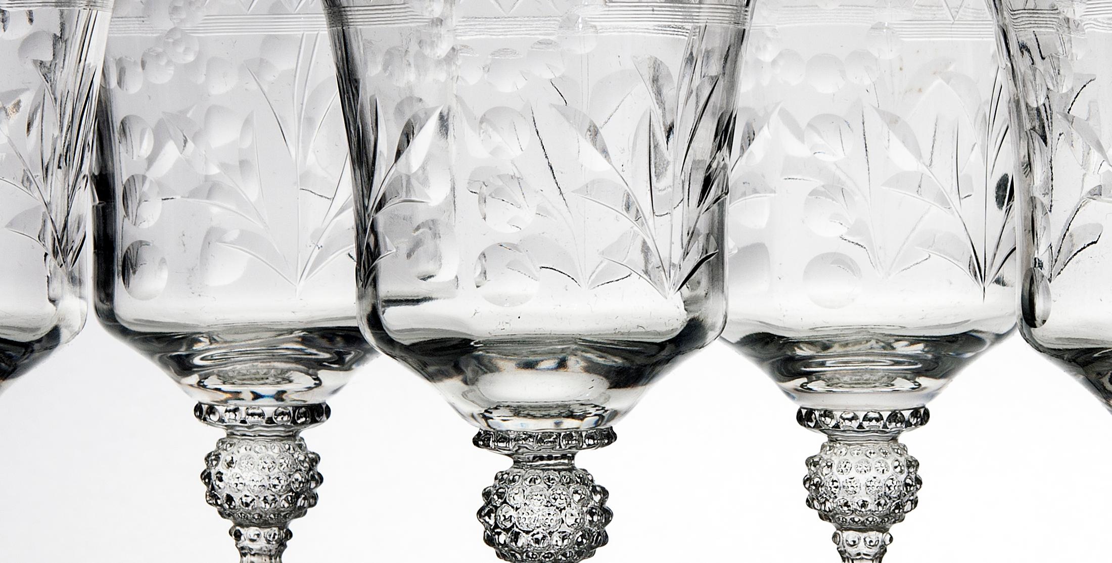 Intricately cut crystal goblets with long hand blown glass stems.
There is another set of six goblets which have a cut crystal, slightly less ornate stem, listed separately. 