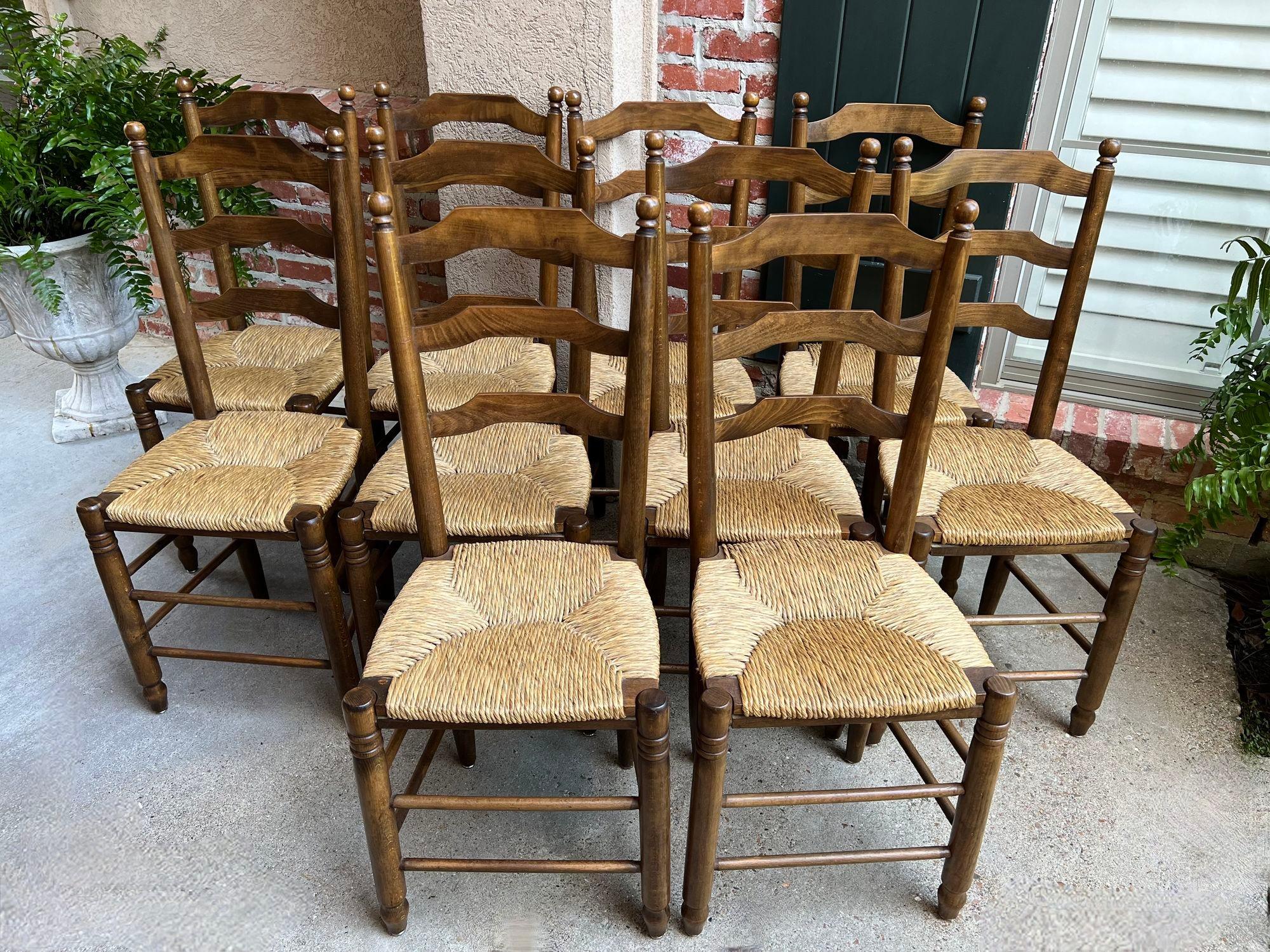 Set 10 Antique French Ladder Back Oak Dining Chairs Rush Seat Vintage Country.

Direct from France, an original set of TEN (10) vintage French dining chairs, perfect for either a dining room or large kitchen with their classic French country