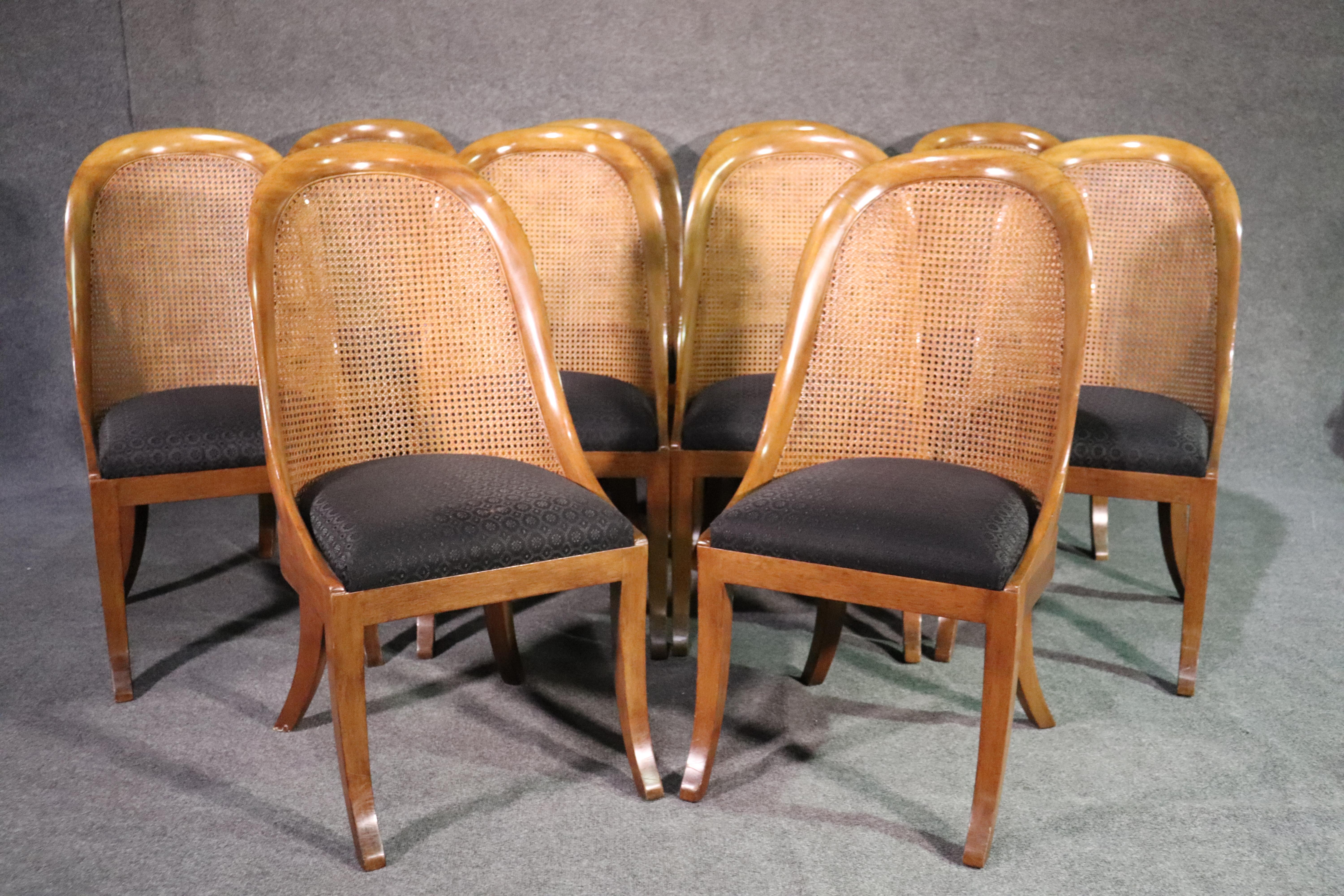 This is a fine set of 10 solid walnut dining chairs. They have the quality of Henredon or Baker but are not marked. The set is in good condition and has sleek lines and no major damage or issues at all. They date to the 1950s. They measure 41 tall x