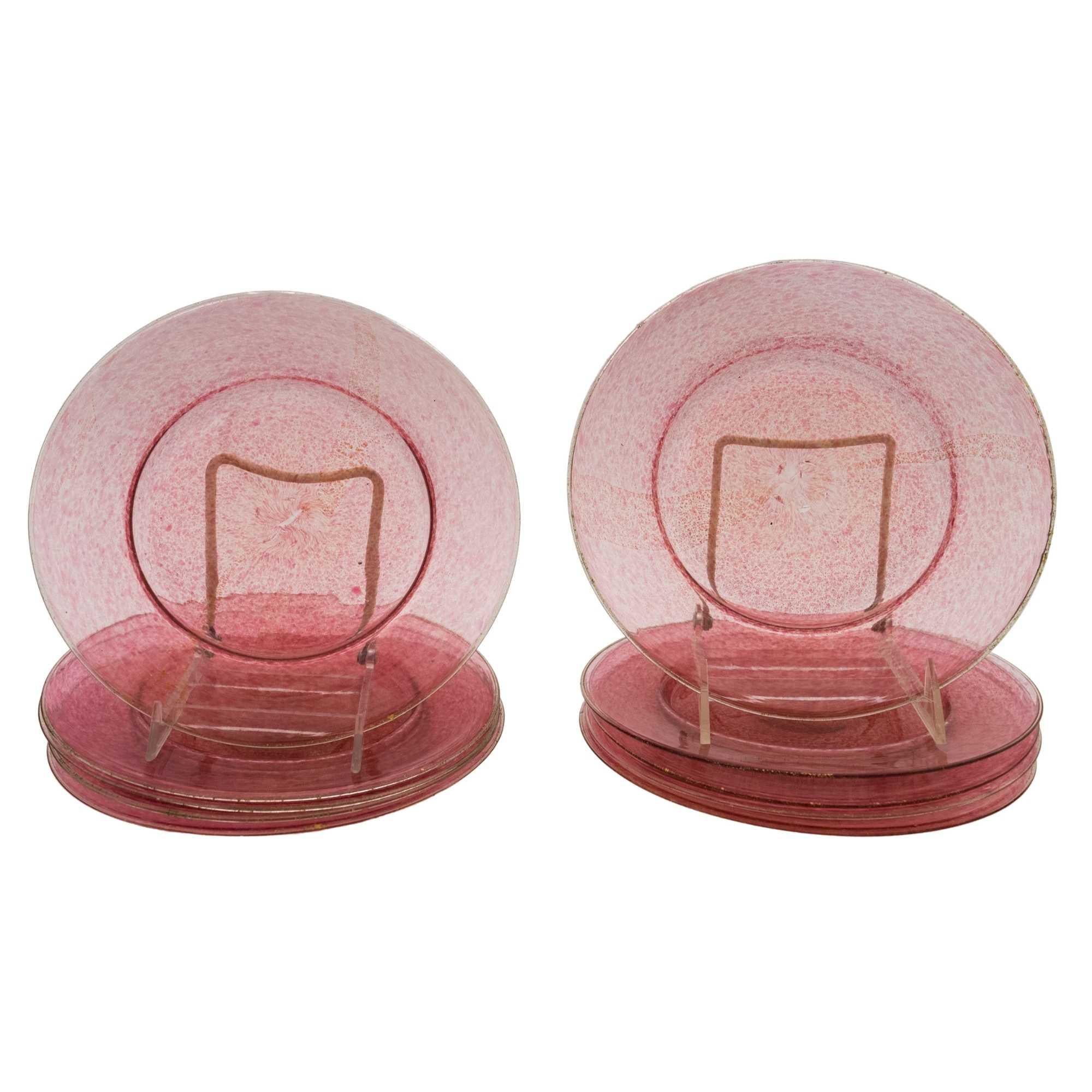 A classic and elegant set of pink dessert or salad plates from the Isle of Murano. A perfect size and nice swirls of 24 karat gold blown into the pink glass. In very nice antique condition.