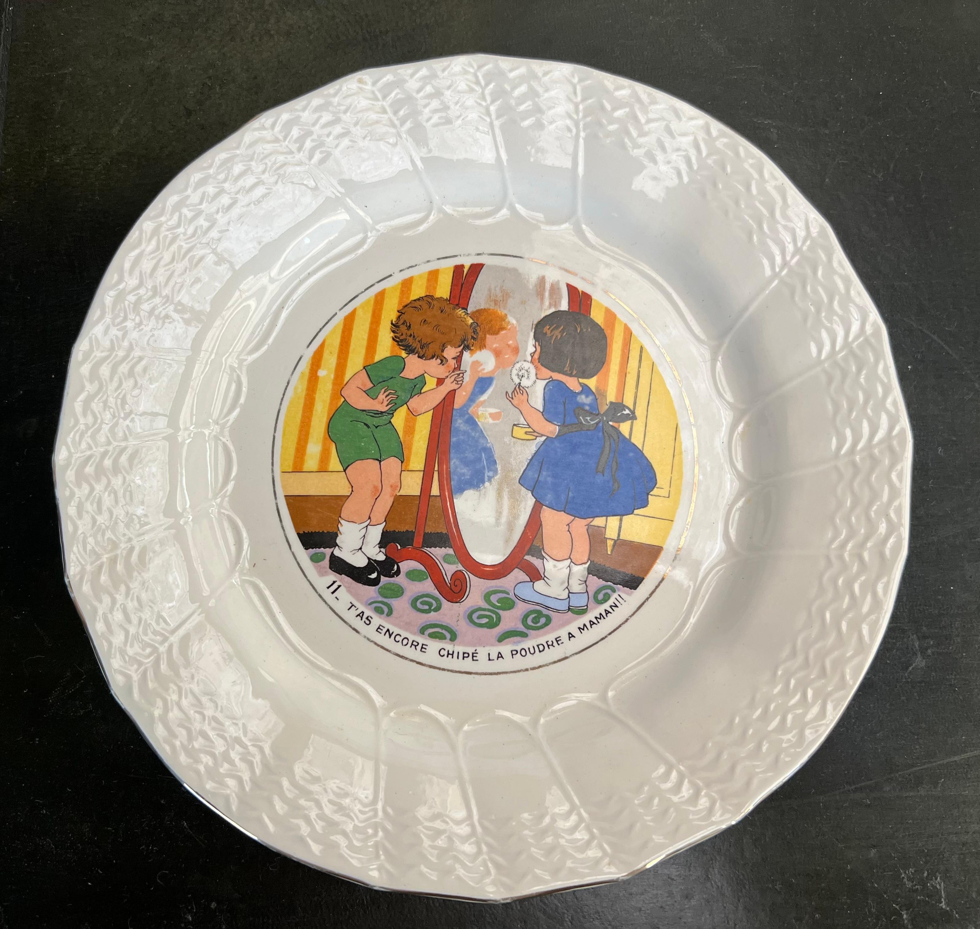 Set of 11 vintage cheese/dessert plates from the Sarreguemines earthenware factory, part of the series inspired by childhood themes. The earthenware is signed Sarreguemines with a raised contour and features the Bicot design. The plates have a
