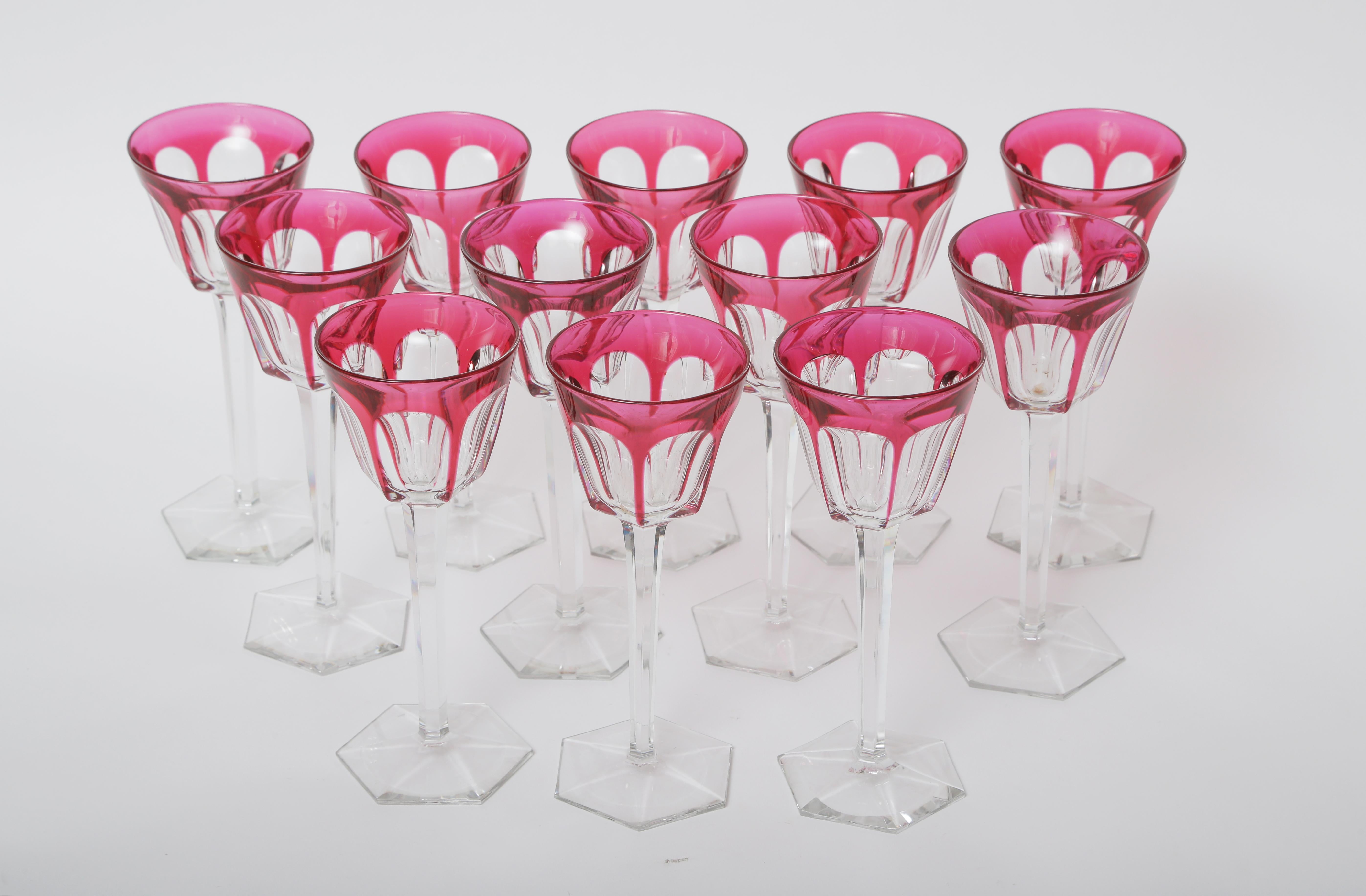 From the re known cristallerie Baccarat, a rich ruby red cased to clear set of 12 wine goblets. These are nice and tall and feature a fully cut stem with a nicely shaped base. In very nice vintage condition and some retain their original hall marks