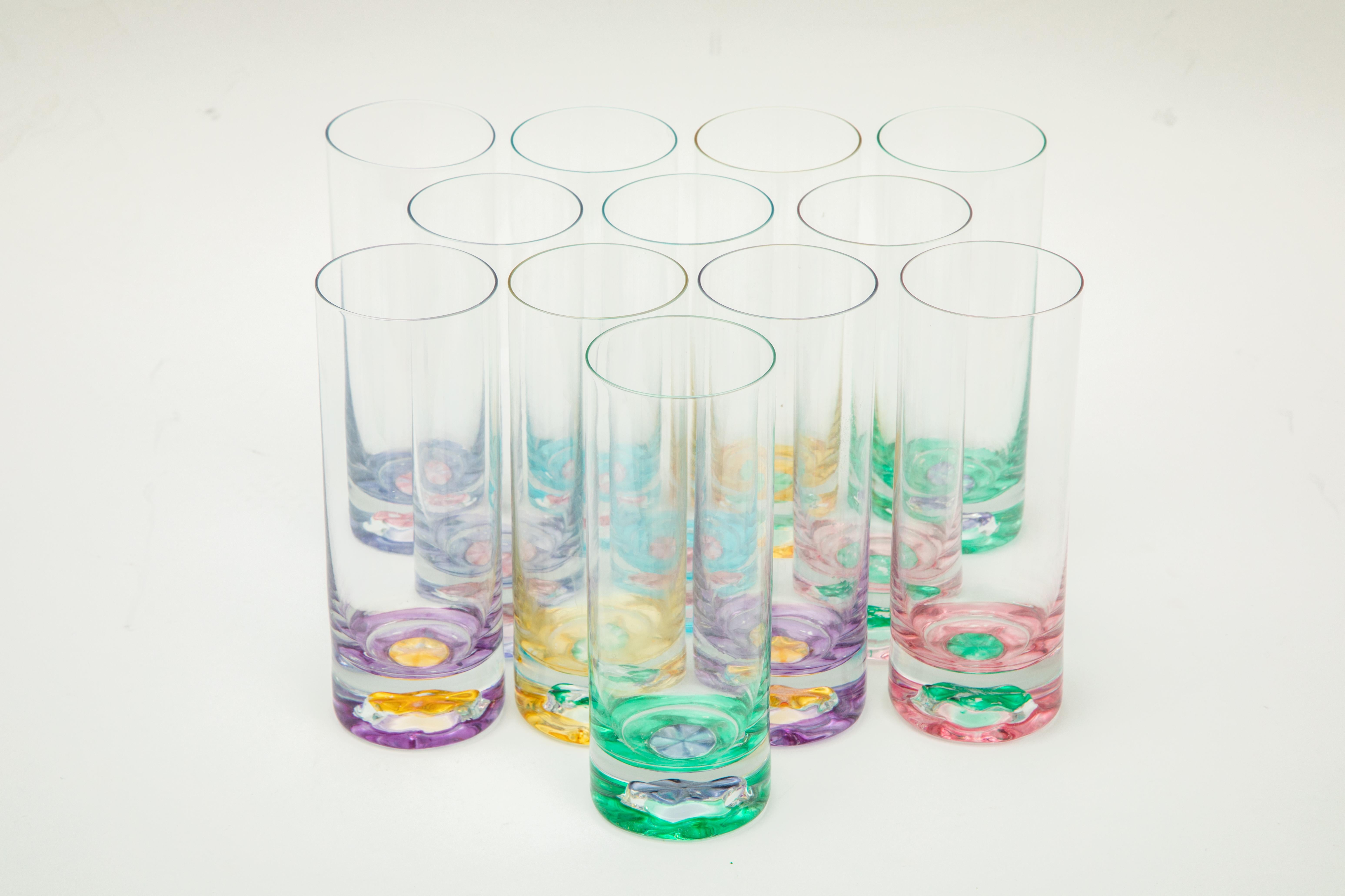 What a fun set of 12 bar glasses ! Beautifully blown with unique assorted colored bases. They are heavy and in really nice vintage condition. Please look at all the pictures and the way the colors work so nicely together. 
Ready, set and mix