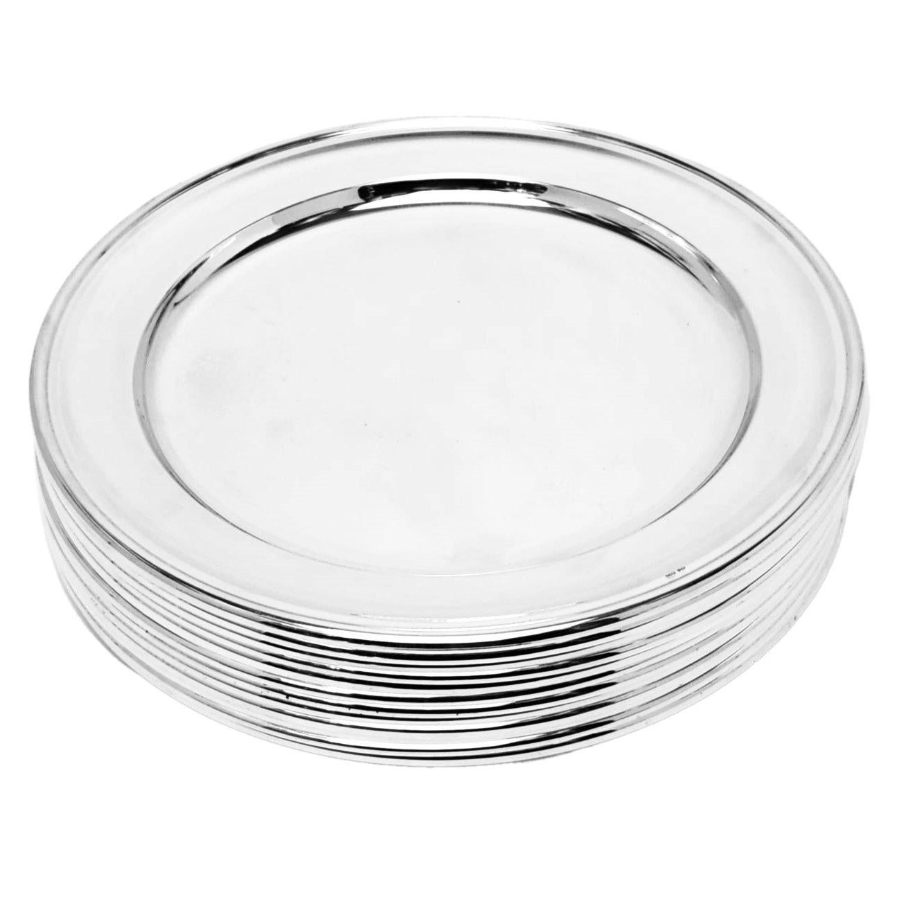 A set of 12 vintage Solid Silver Underplates. These round Silver Chargers have an elegant, understated design that enhance the highly polished silver finish. 

Made in Italy in c. 1950 in 800 standard Solid Silver.

Approx. Total Weight - 6514g