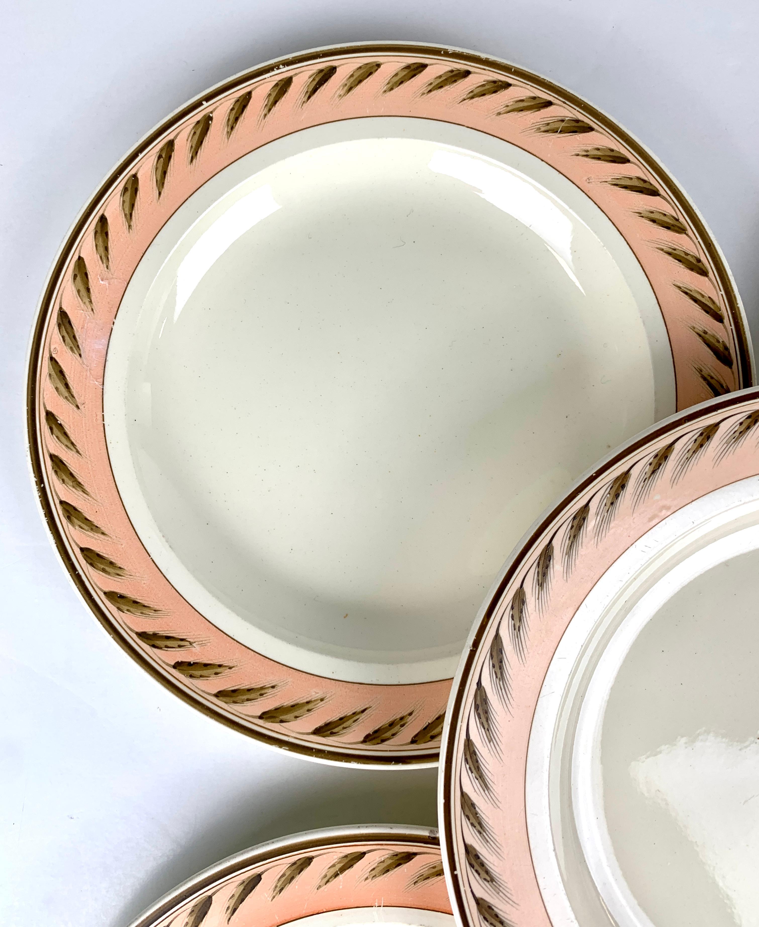 Made in England in the early 19th century, circa 1815, these Wedgwood dessert or salad dishes are a beautiful and sophisticated set. The combination of the creamware body with the peach color border and the 18th-century Wedgwood 