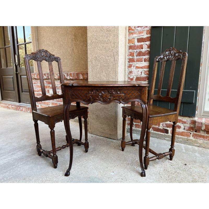 Set 19th Century French Louis XV Pastry Game Table w Chair Carved Oak Bistro.

Direct from France, a fabulous SET that includes a 19th century pastry or game table and it’s two matching chairs!
The square table has superb Louis XV style, with it’s