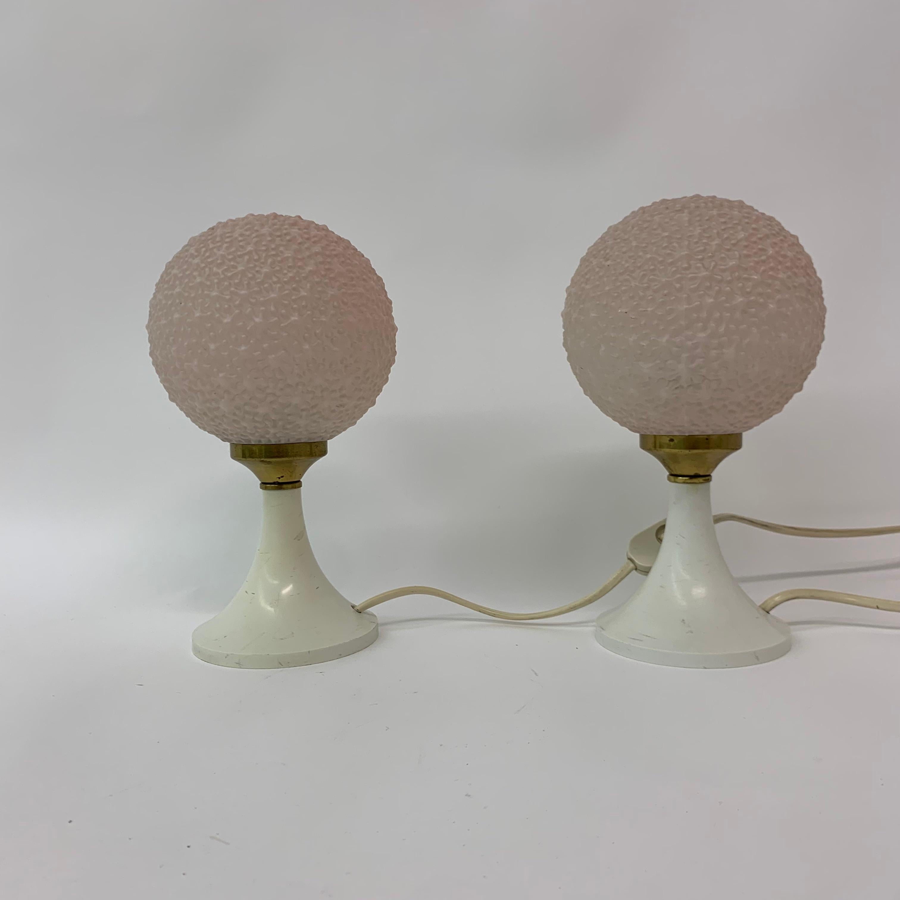 Set of 2 table lamps with pink glass bubble shades.