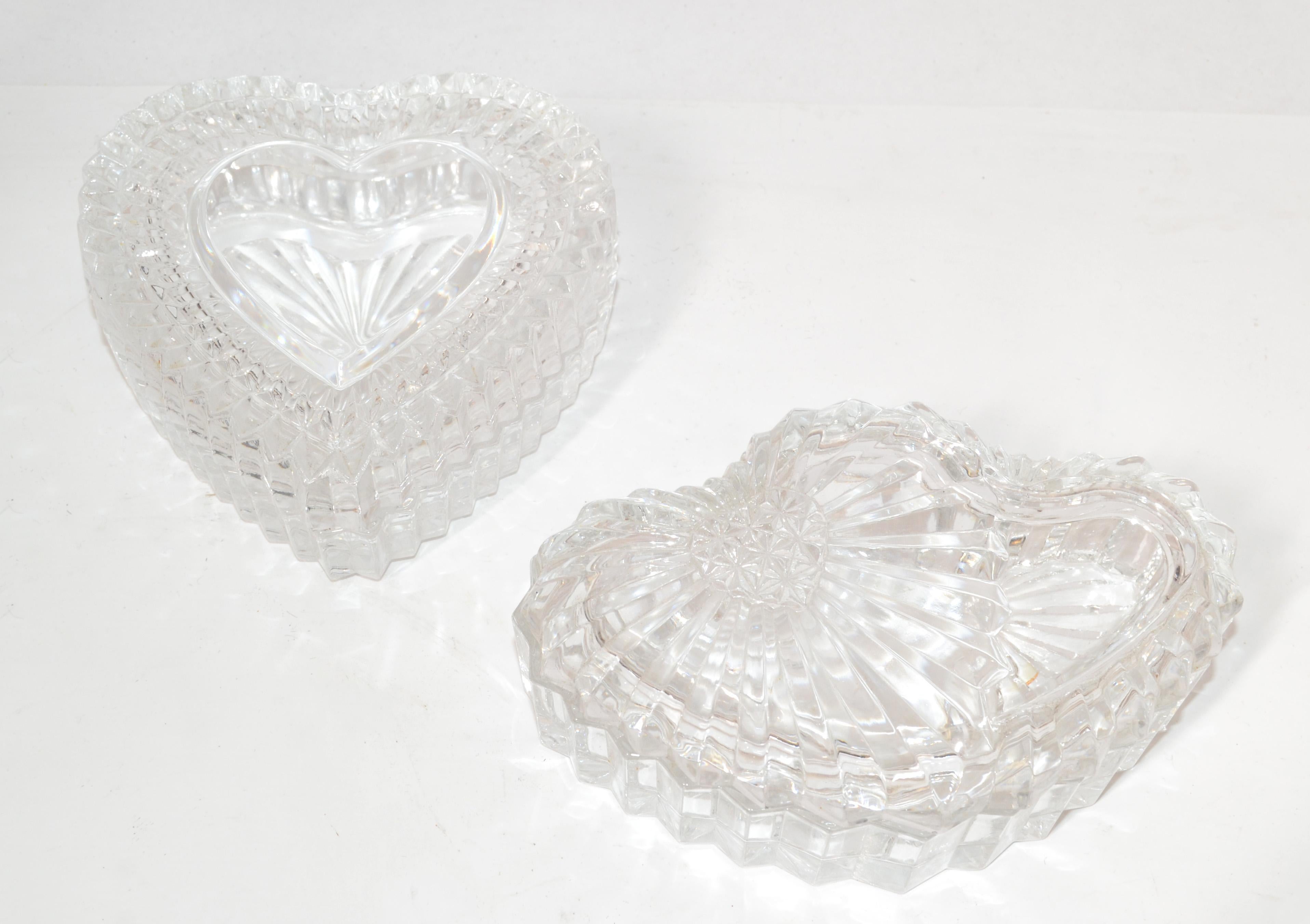 Set of 2 handmade cut and beveled Glass Heart shaped lidded Boxes, Candy Dish, Jewlery, Keepsake, Trinket Boxes.
Beautiful craftsmanship for so many memorable things.
Simply a lovely Wedding or Christmas Gift. 
Smaller Dish measures: 5.5 x 3.75 x