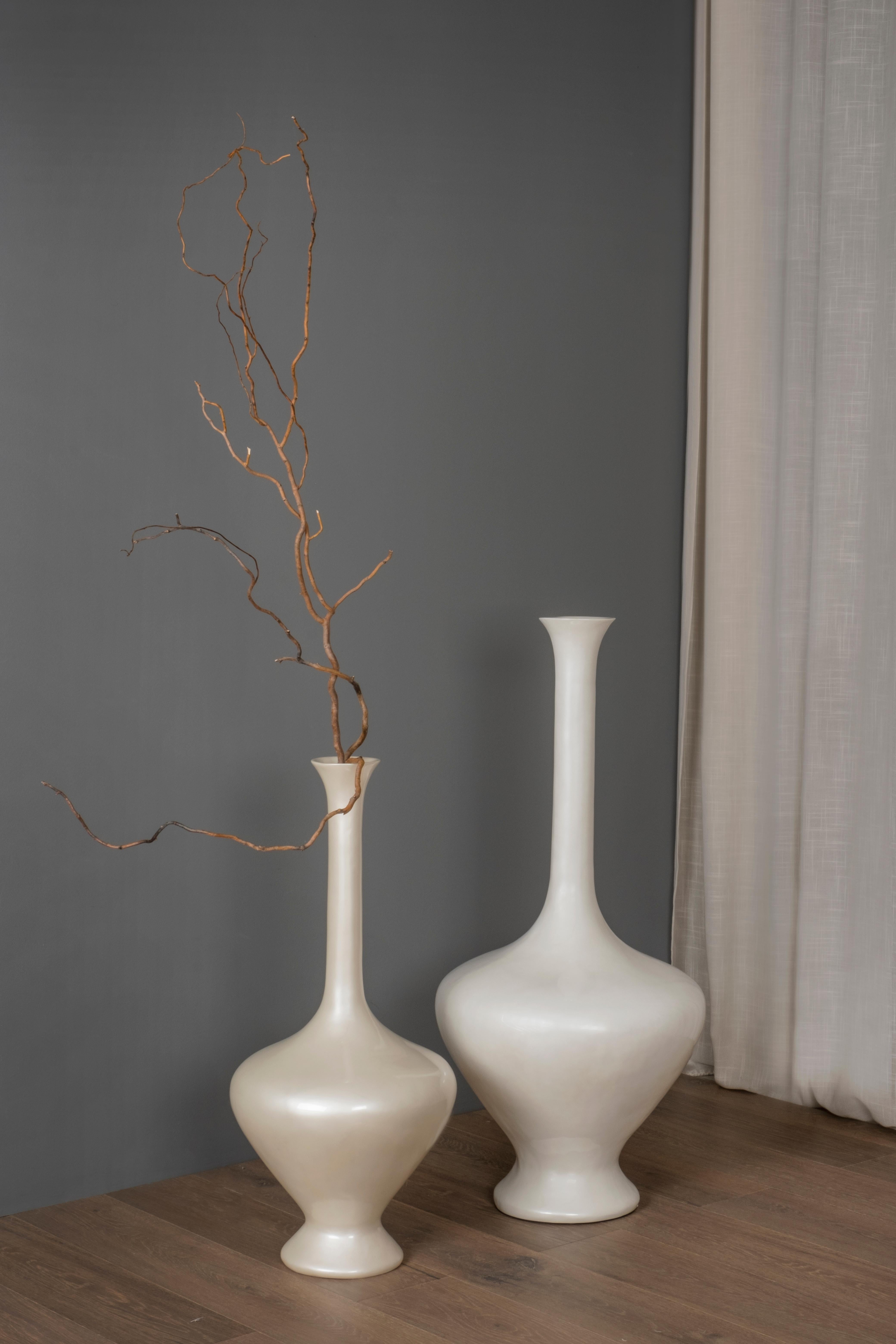 Set/2 Decorative Floor Vases, Lusitanus Home Collection, by Lusitanus Home.

This beautiful set of two resin floor vases that catches the eye with its pearl white elegant silhouette. These floor vases are the perfect decorative choice to enrich any