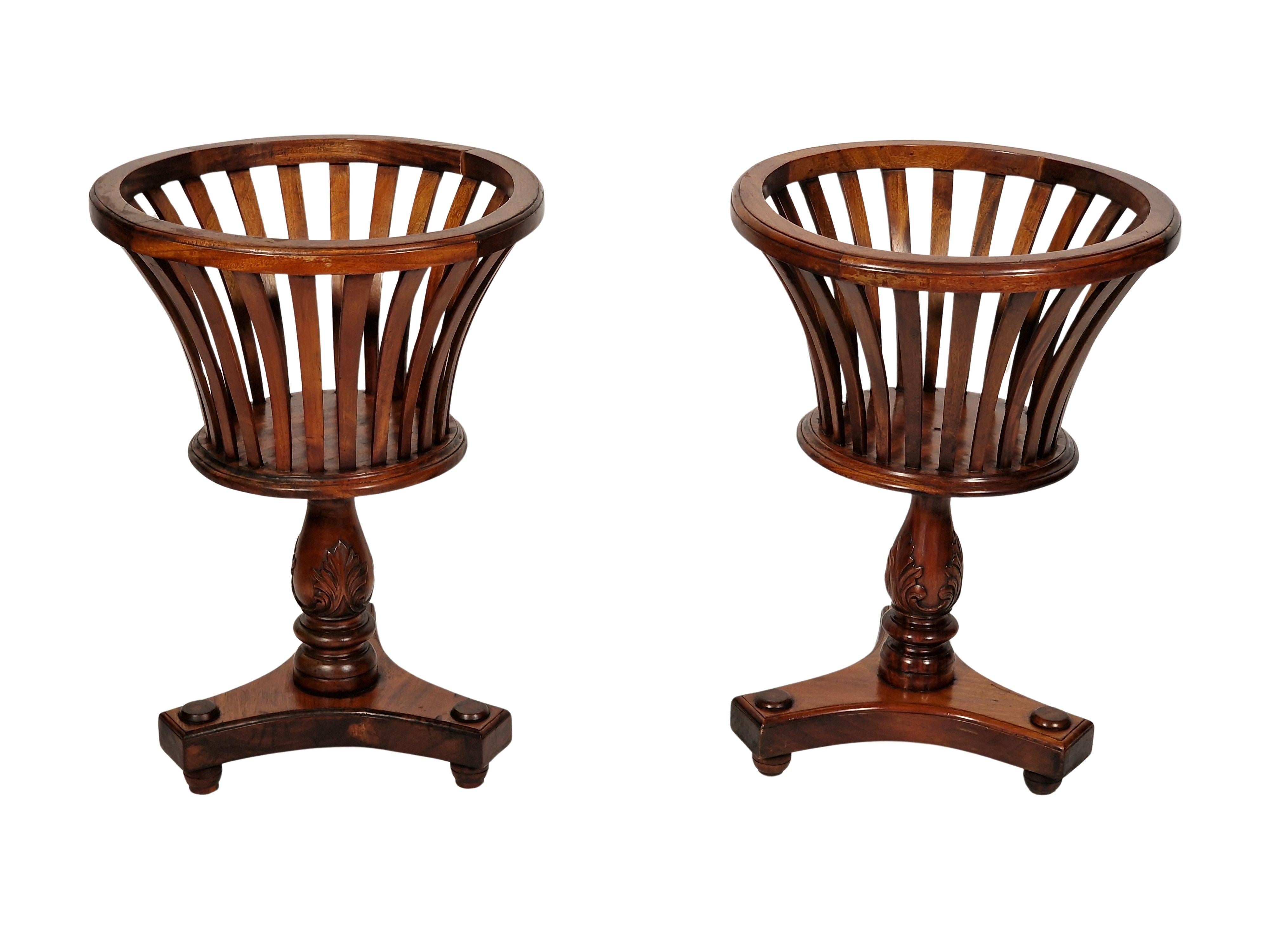 Marvelous set of two plant stands, made around 1860s in late Biedermeier time of solid carved and slatted mahogany. 

This classic piece of furniture has the elaborate shape of the time and high-quality workmanship. The plant stands are made of