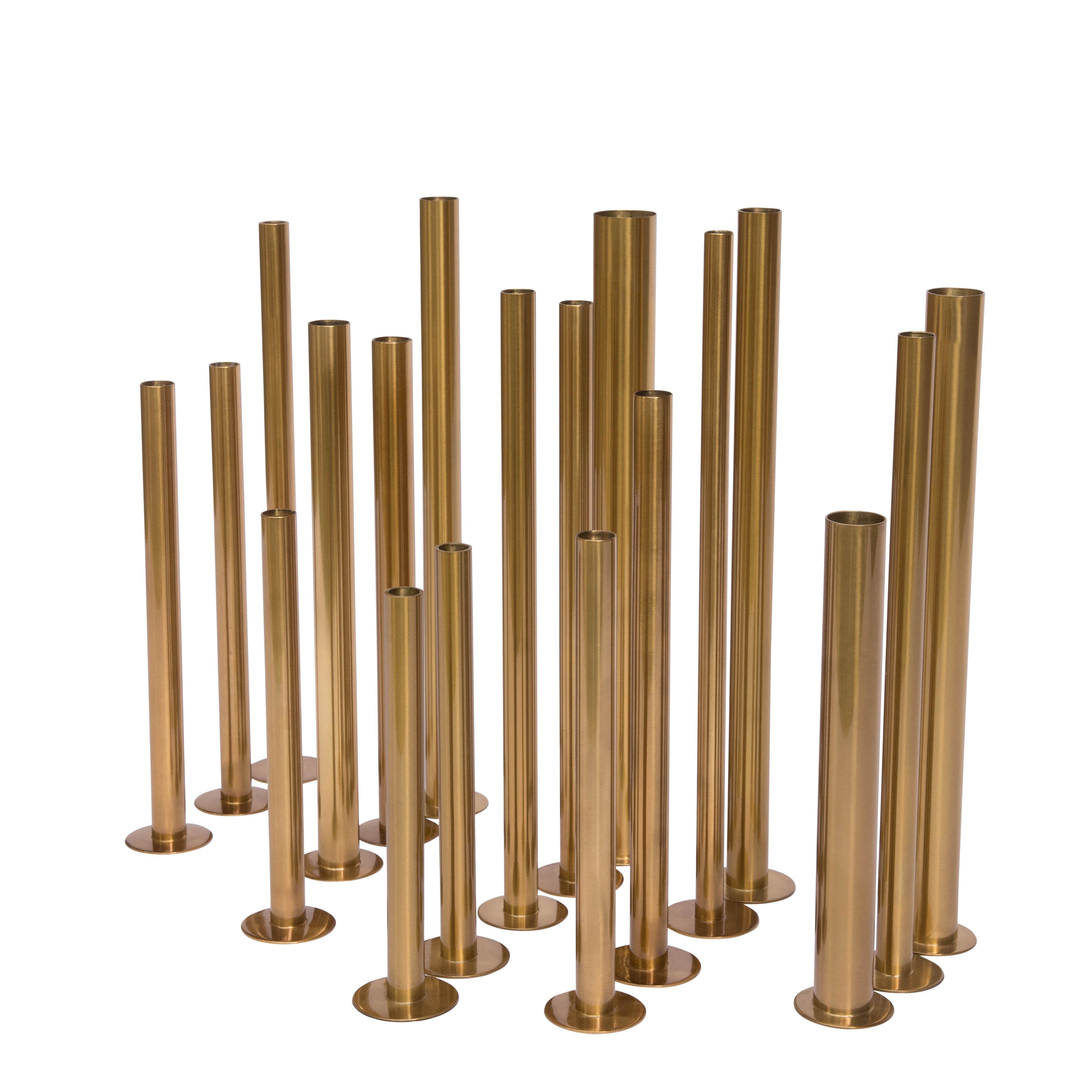 Set of flower holders, handmade brass cylinder-shaped made of different sizes in diameter and heights. Handmade brass cylinder-shaped made of different sizes and heights.

A set of 20 brass sculptures which could used as a flower holder designed