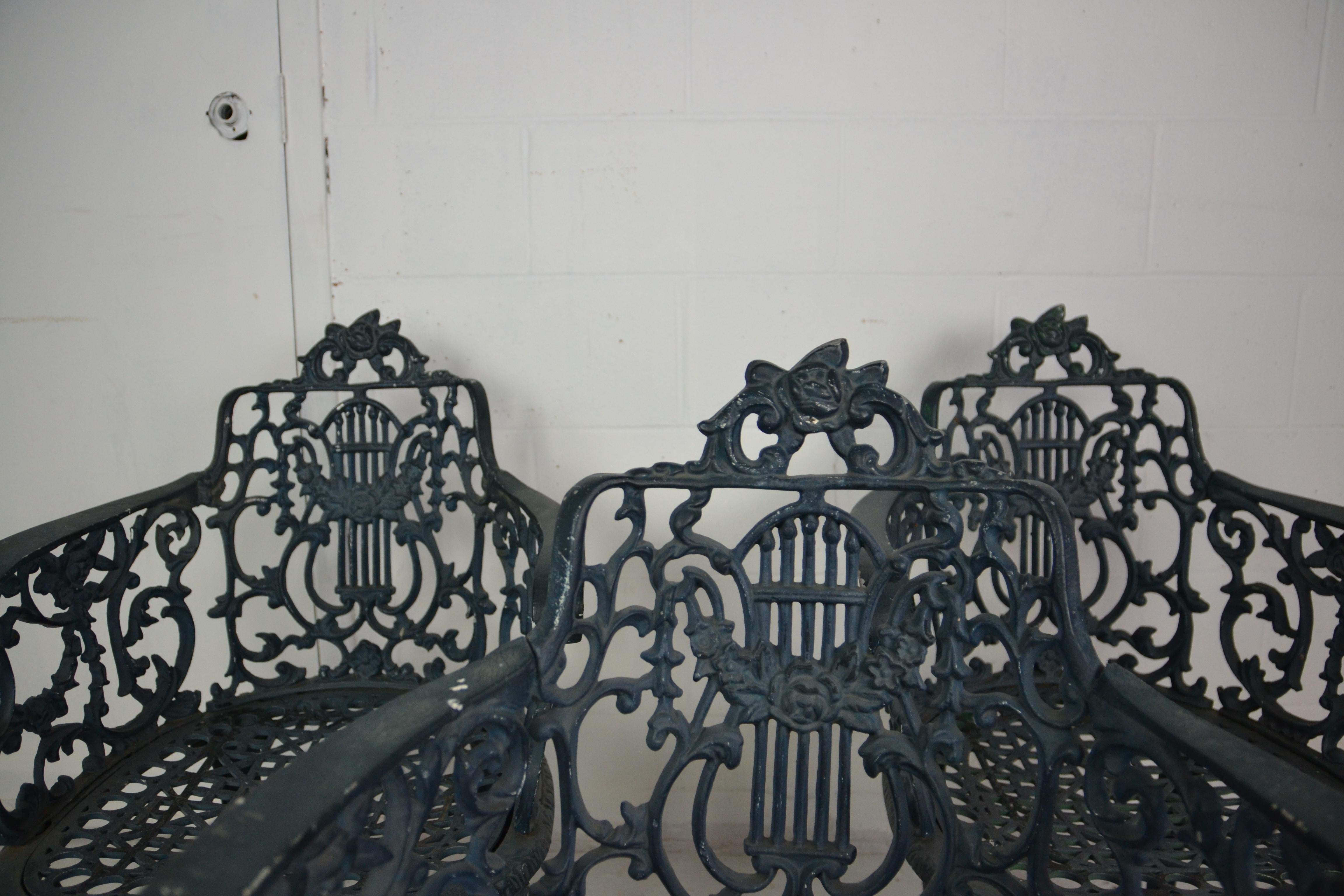 A set of 3 midcentury period garden chairs in an earlier style. Cabriole style legs. Very ornate design in an old forest green paint finish.