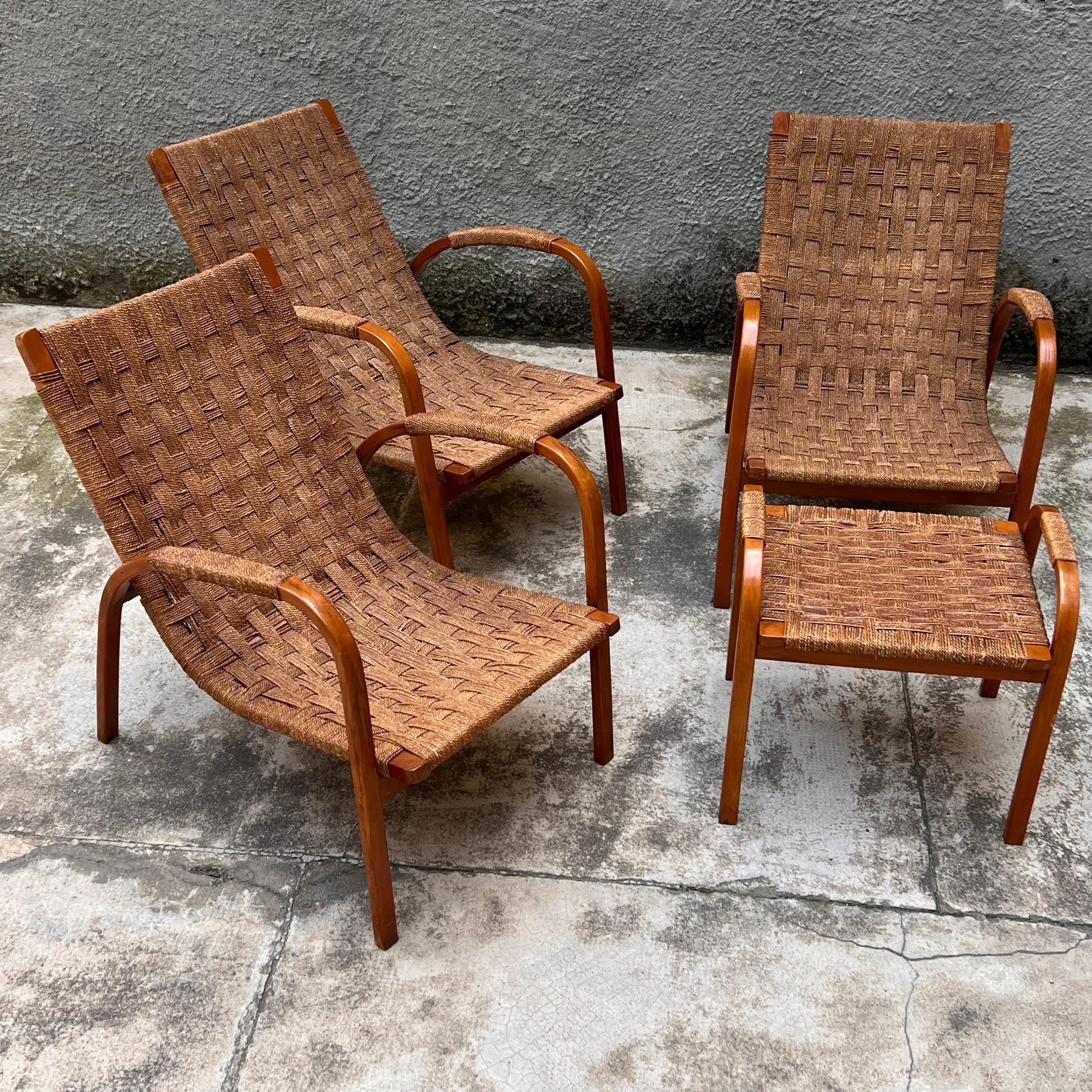 This exclusive set of chaise lounges, consisting of three armchairs and a stool/pouff, was designed and made in Italy in the 1940s by Giuseppe Pagano Pogatschnig. The design exemplifies the elegance and functionality typical of the modernist