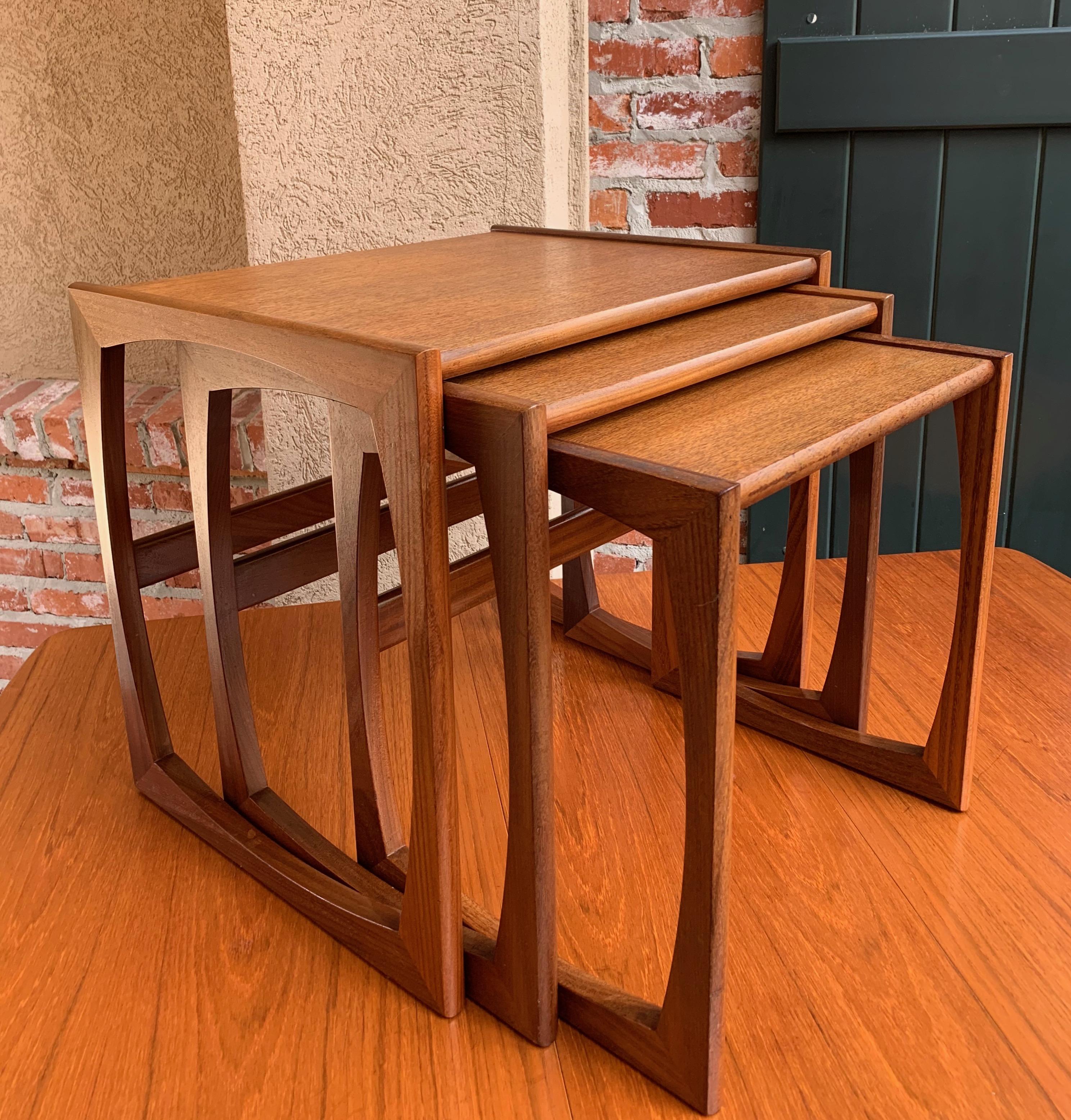 Direct from England, a lovely set of 3 nesting tables
~ Mid-Century Modern styling with gorgeous teak veneer
~ G Plan tag on the underside,
~ circa 1960
(Note: We recently purchased several of these Mid-Century Modern nesting tables and dining