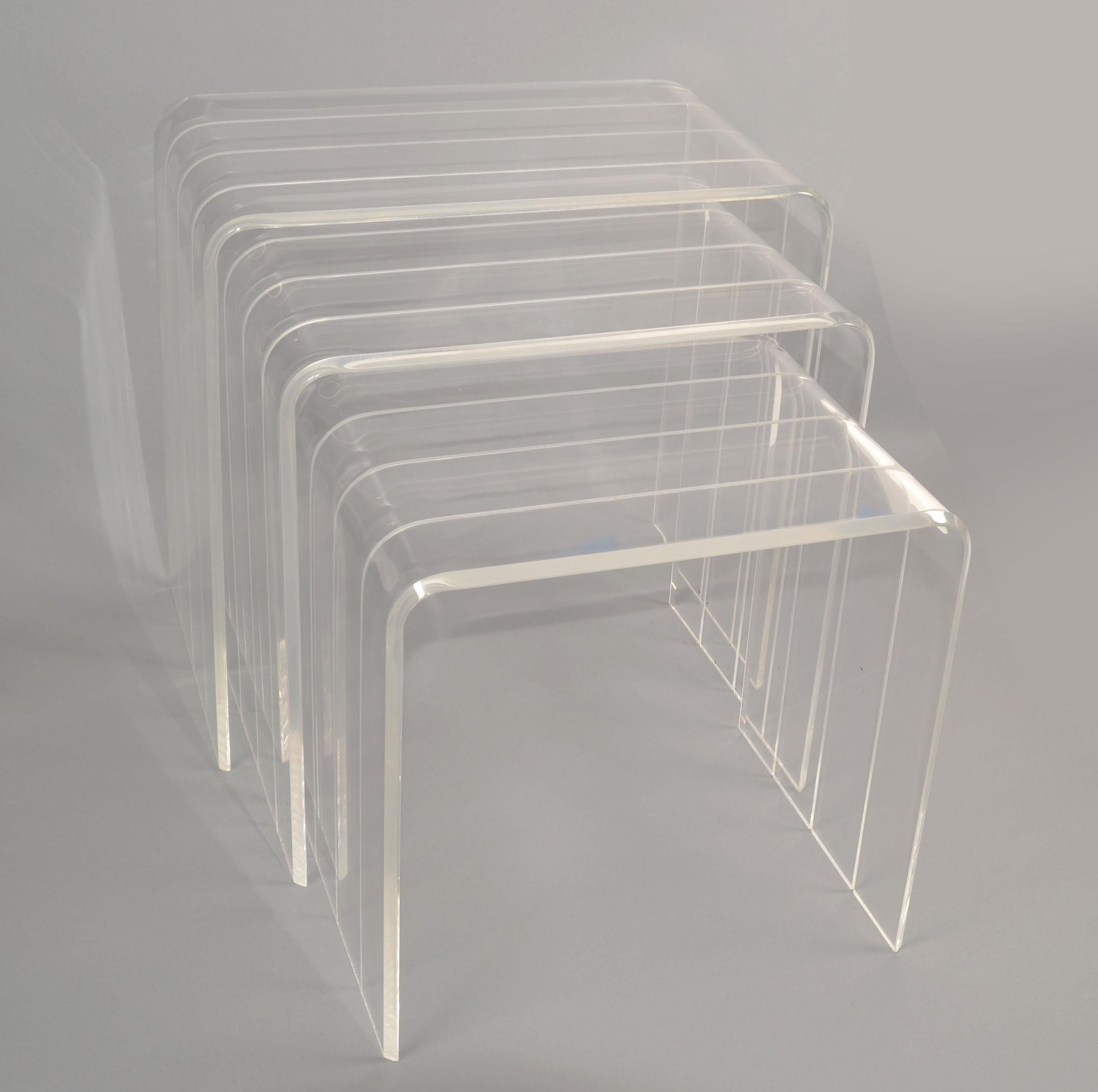 Set of 3 Italian Mid-Century Modern handcrafted and etched waterfall Nesting Tables, Stacking Tables, Stools.
Deco Revival Lucite Drink Tables made in Italy circa 1970.
Newly polished and in very good condition, ready for a new Home.
Size of each