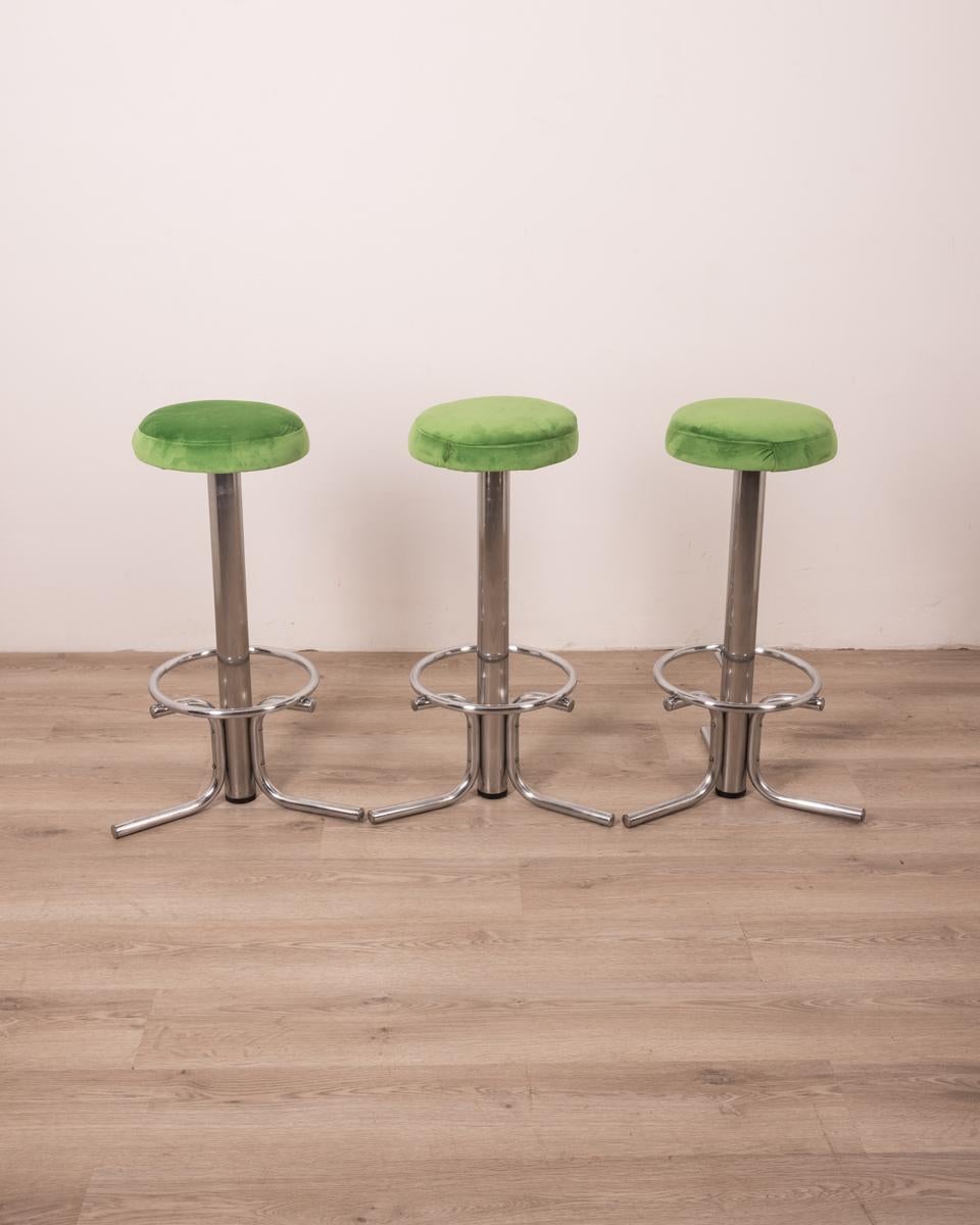 Set of three stools with chromed metal frame and green fabric upholstery, 1970s, Italian design.

CONDITION: In good condition, show signs of wear given by time.

DIMENSIONS: Height 77 cm; Diameter 45 cm

MATERIAL: Metal and Fabric

YEAR OF