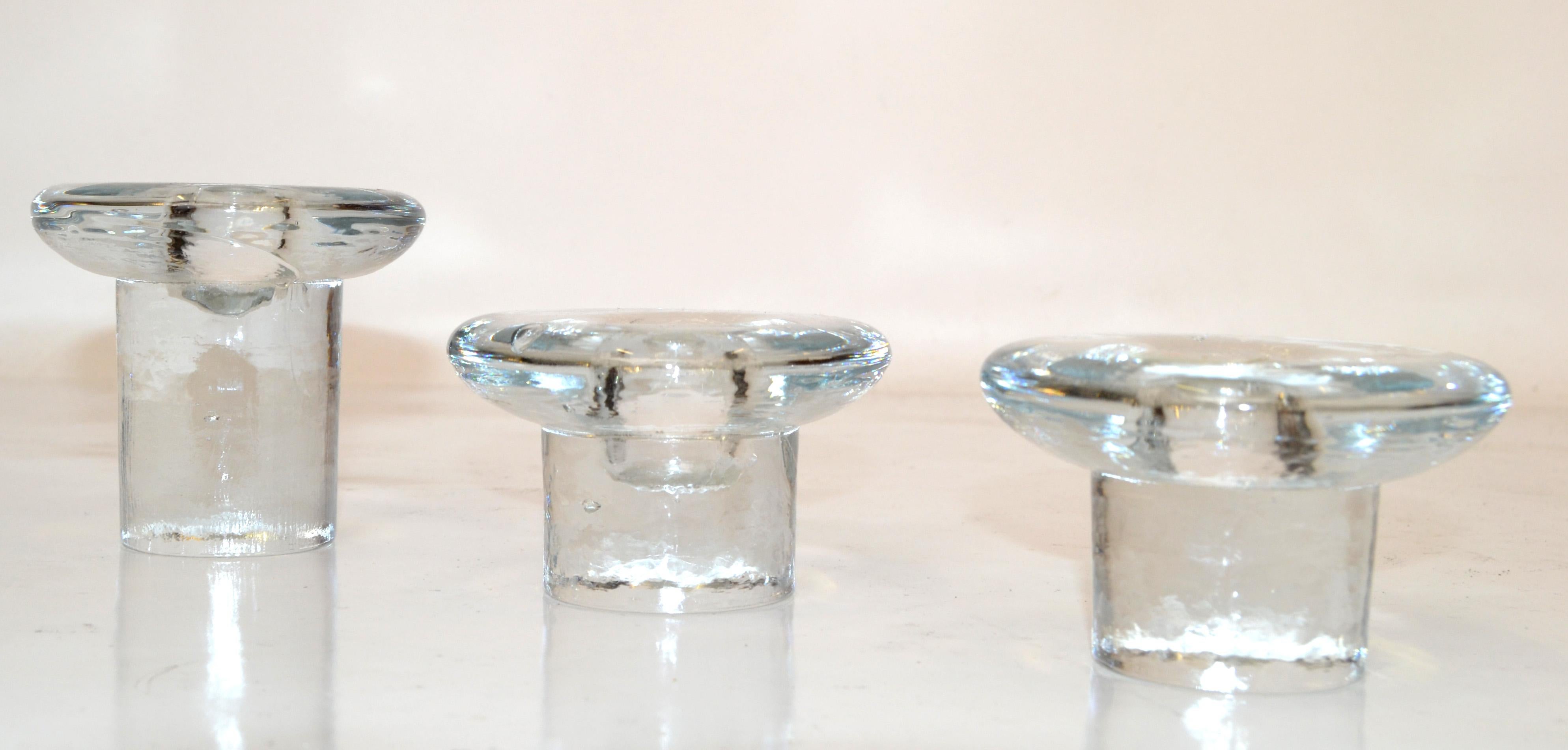 Set of 3 Vintage Blenko Transparent Art Glass Ice Mushroom Candle Holders designed by Don Shepherd made in the United States in circa 1970s.
Makers Mark at the top of the Candle holder.
The 2 smaller Mushroom Crystal Glass Candle Holders measure: