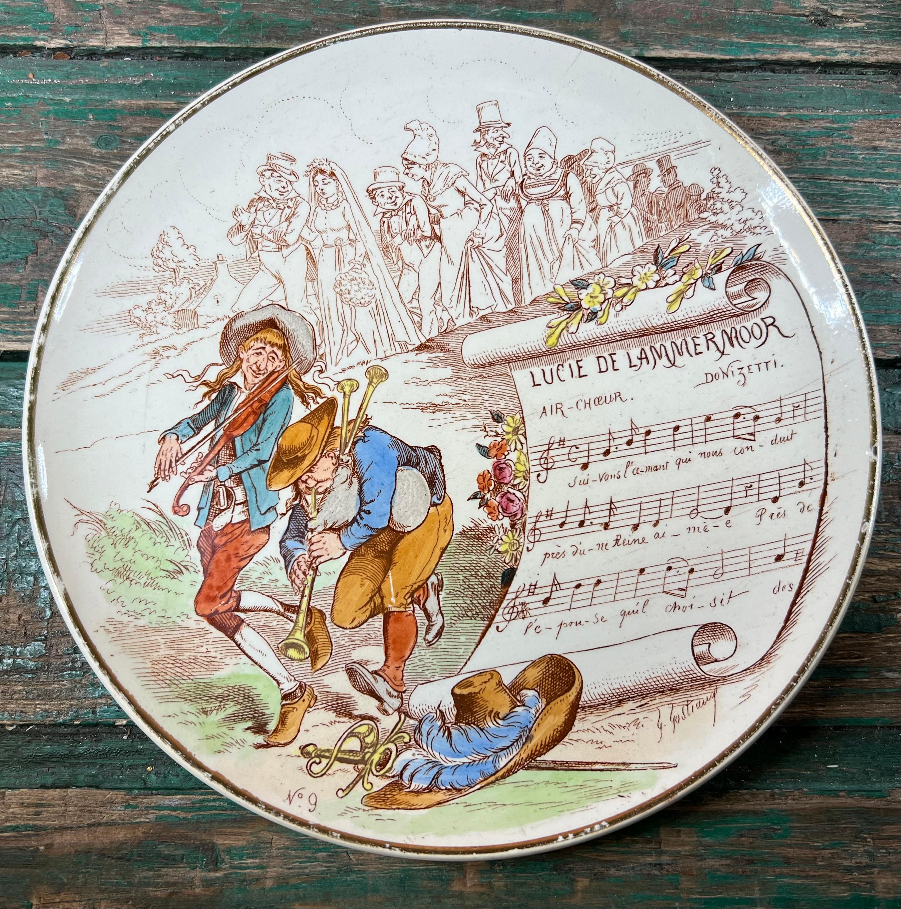 A very nice set of 3 earthenware plates from Creil-Montereau Terre de Feu, from the series of Musical Subjects, representing 3 famous operas with various characters illustrating the theme and musical scores, dating from the late 19th to early 20th