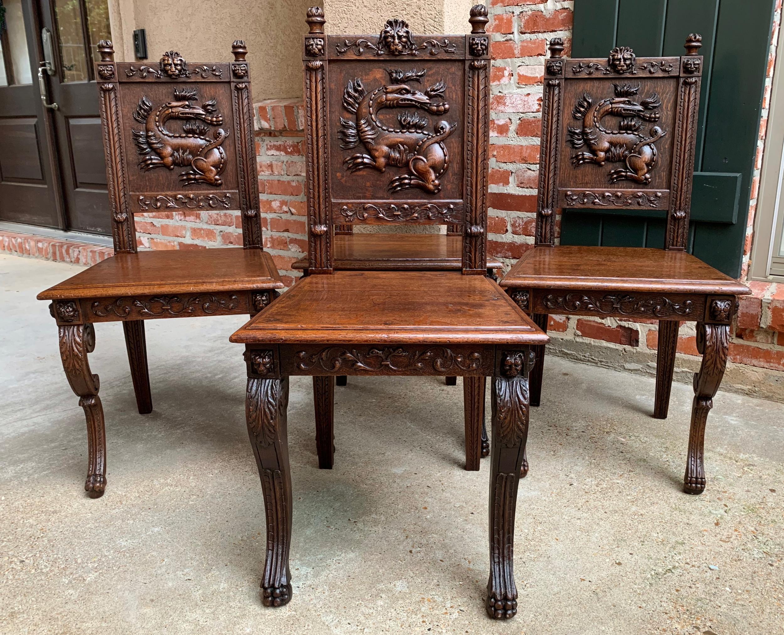 Set 4 antique French carved oak dining chair Renaissance dragon lion Gothic

~Direct from France~
~Unique set of 4 antique French carved chairs, suitable for a dining room, kitchen, and great as side chairs in any room~
~Carved embellishments