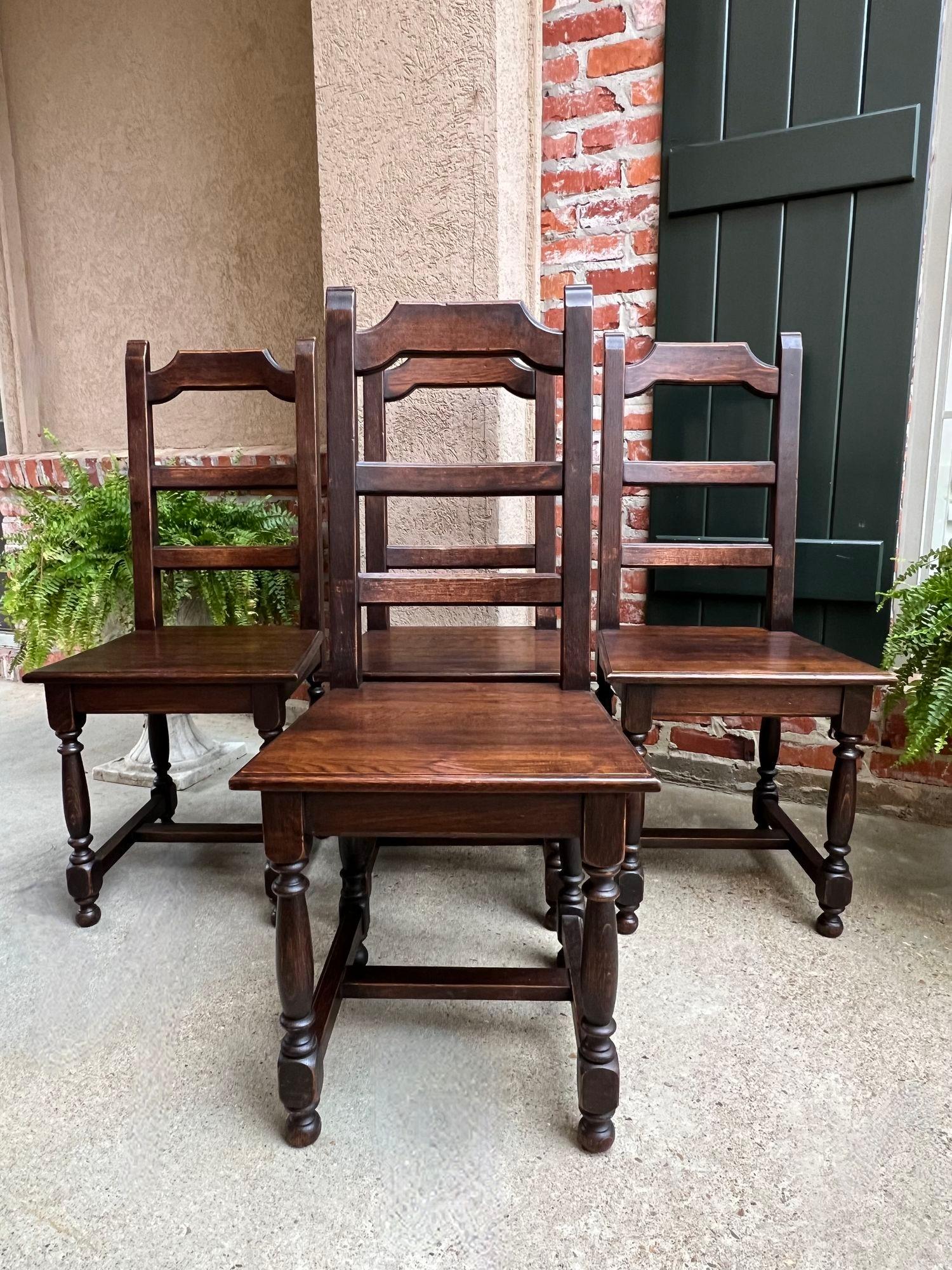SET 4 Antique French Country Dining Chair Ladder Back Carved Dark Oak.

Direct from France, a set of 4 antique French dining chairs, with classic French style that compliments any décor!
Shaped upper crown with a lovely silhouette that features wide