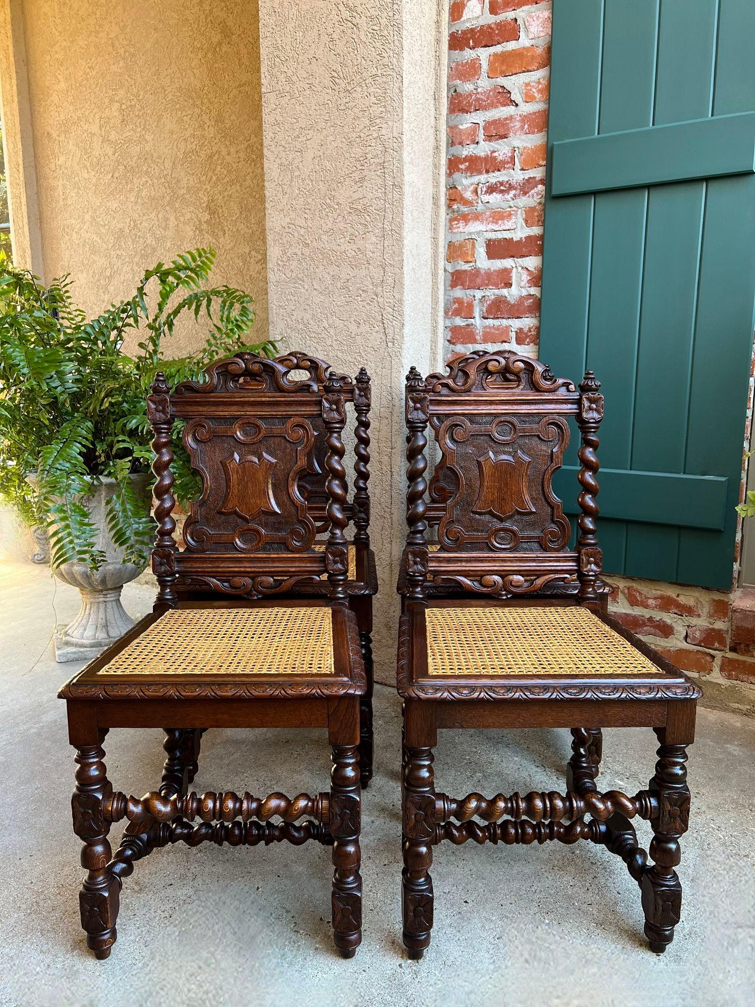 Set 4 Antique French Dining Chairs Barley Twist Cane Seat Carved Oak c1920.

Direct from France, a beautiful set of 4 antique French dining chairs! Ornately carved, with serpentine crowns and shaped back panels having carved center shields.
Carved
