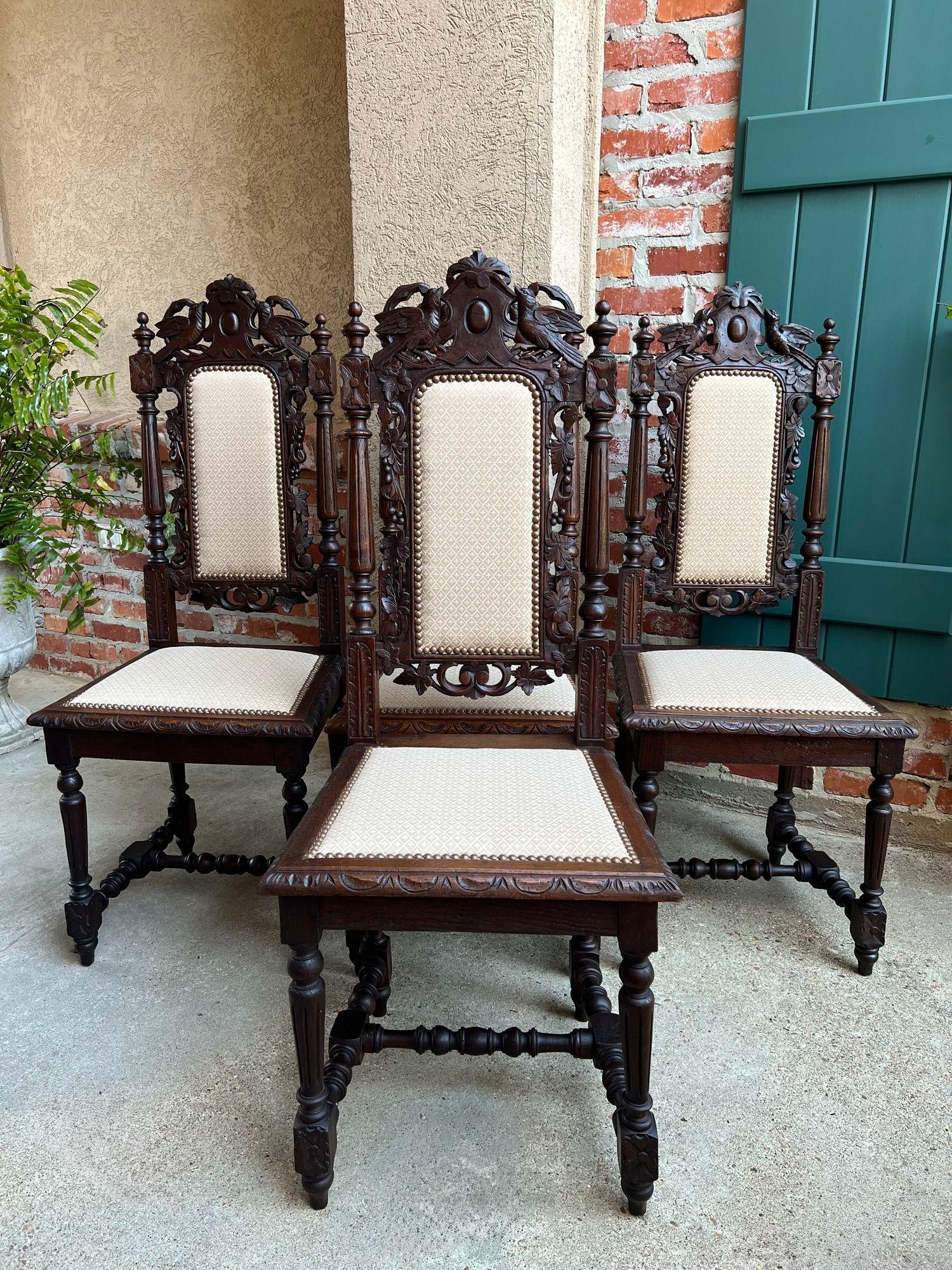 Set 4 Antique French Dining Chairs Renaissance Carved Oak Bird Black Forest.

Direct from France, a gorgeous set of 4 antique chairs, heavily carved in Renaissance/Baroque style. Stunning for a formal dining or French kitchen and with their abundant