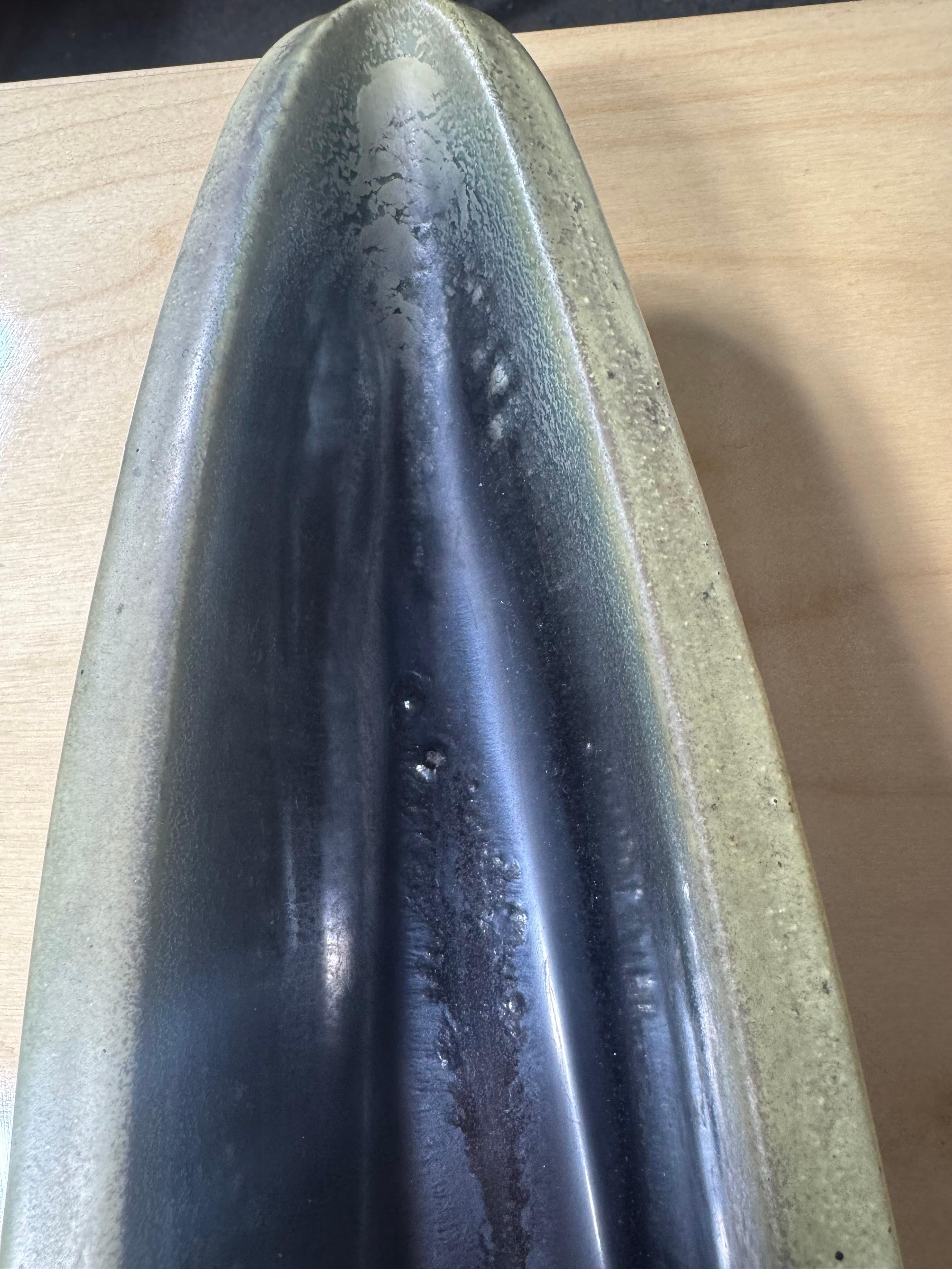 Stunning collection of Four Russel Wright Bauer vessels. This set includes , seldom seen (large) canoe and  3 jug vase's.Amazing colors and glazes. excellent condition,,
Introduced in 1939, Russel Wright’s American Modern line garnered appeal with