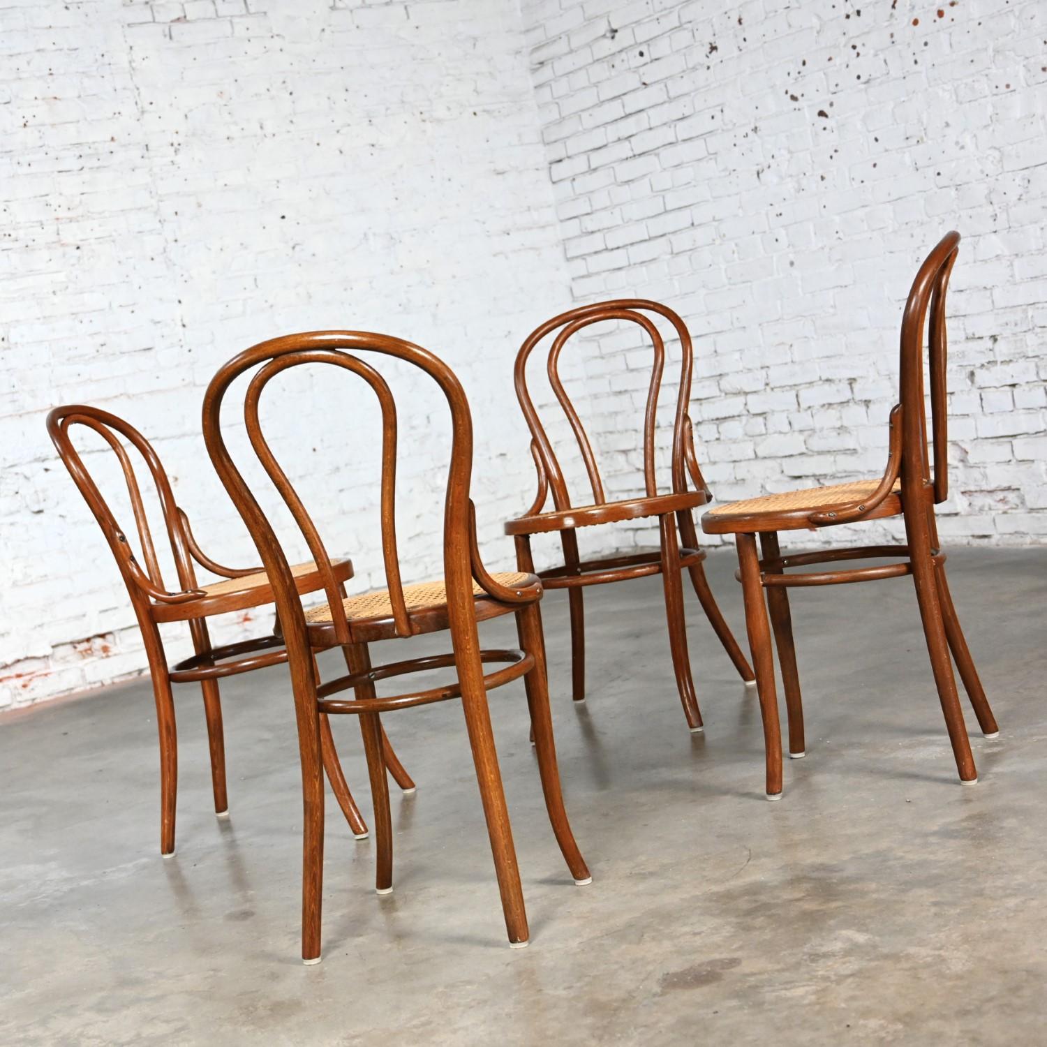 Fabulous Late 19th to Early 20th Century Bauhaus style #18 Café Chairs by Thonet comprised of bentwood frames and newly hand canes seats. Beautiful condition, keeping in mind that these are vintage and not new so will have signs of use and wear even