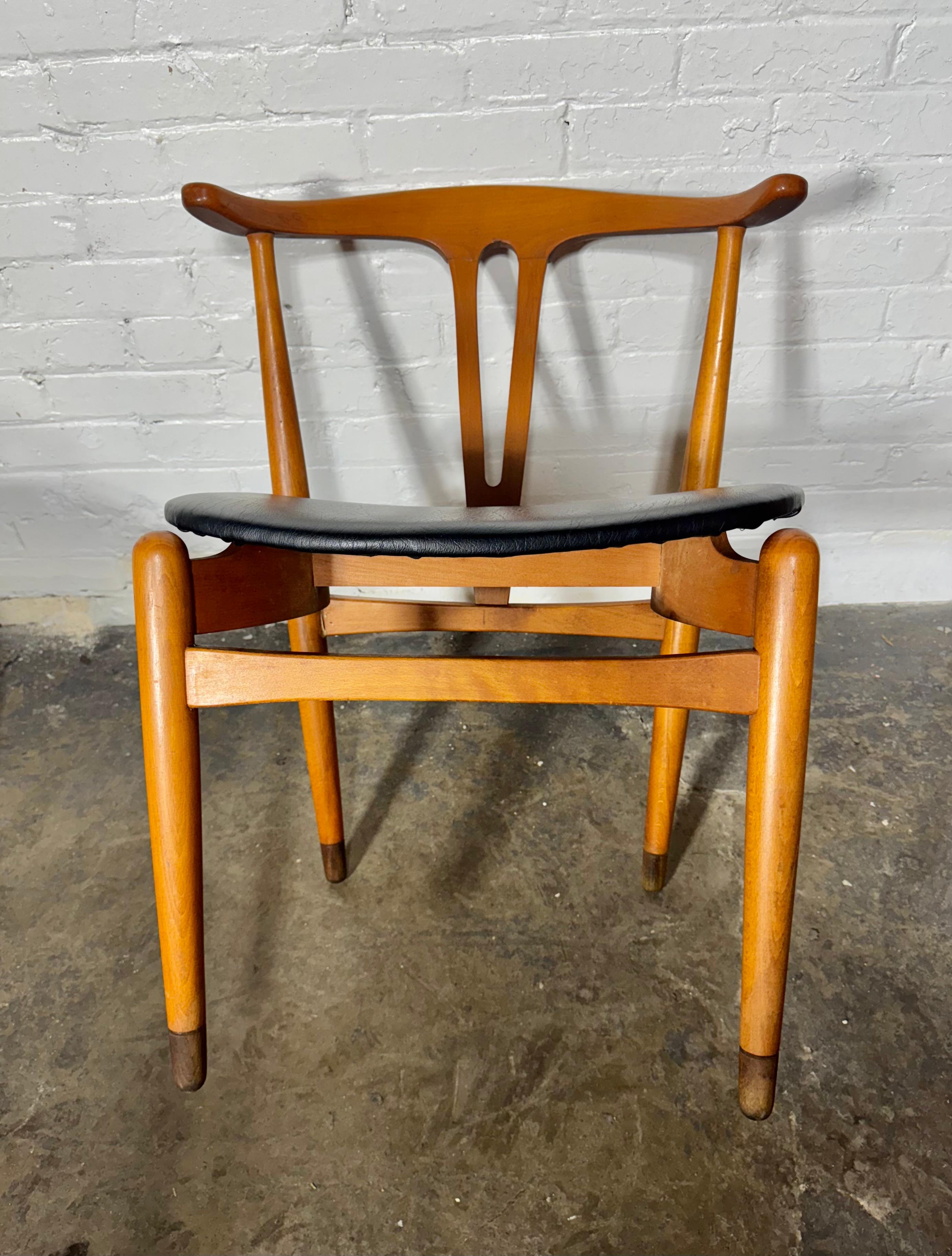 Set 4 Cow horn Chairs by Folke Sundberg for Broderna Edmans Stolfabrik of  Sweden.  Crafted in  solid beech with ebonized feet. Classic floating seat with black naugahyde upholstery,, Retain original finish / patina, Amazing proportion ,design,,